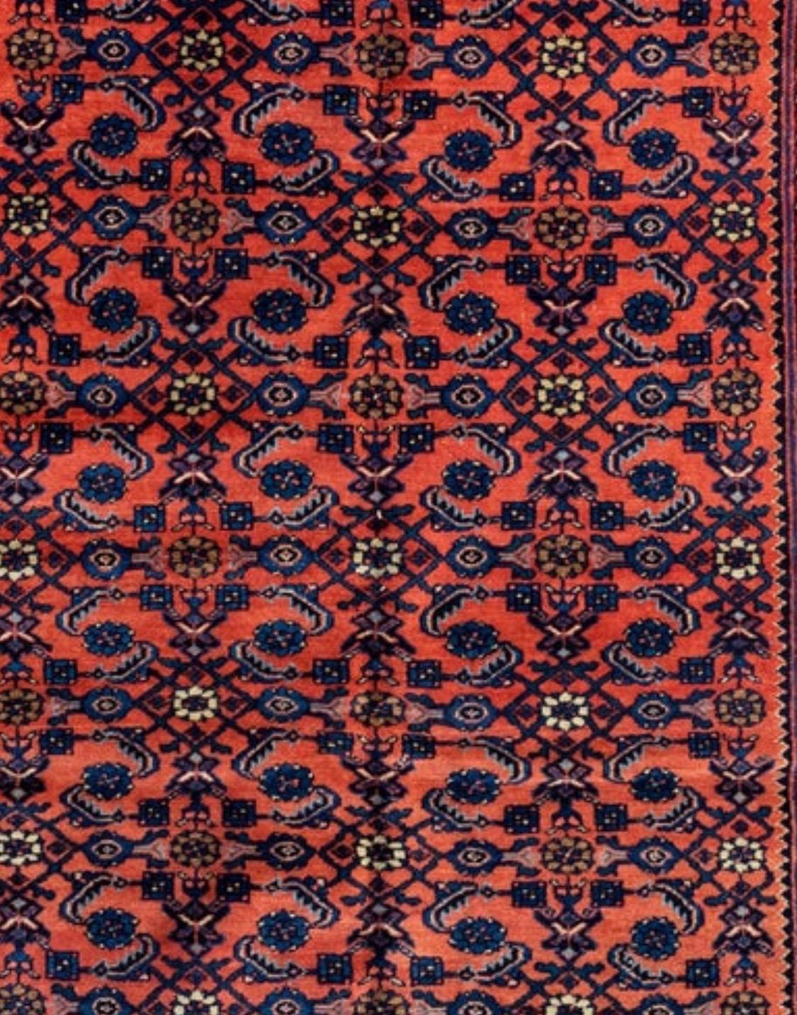Antique rose red and navy blue Persian Angeles (or Fine Lilihan) rug handwoven in the south of the city of Arak by Armenians in Iran.

Lilihan rugs are known for their design. Traditionally designed with a curvilinear lattice with traditional