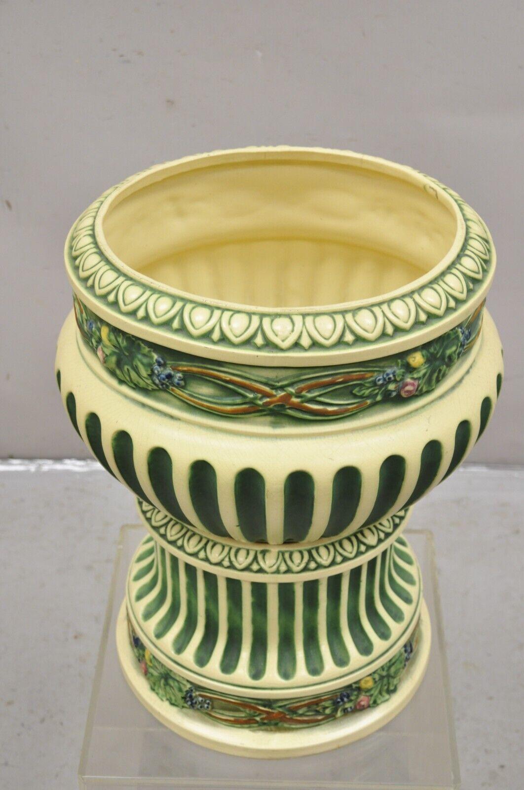 Antique Roseville Corinthian Pattern Jardiniere Planter and Rare Low Pedestal. Circa Early 1900s.
Measurements: 
Overall: 22