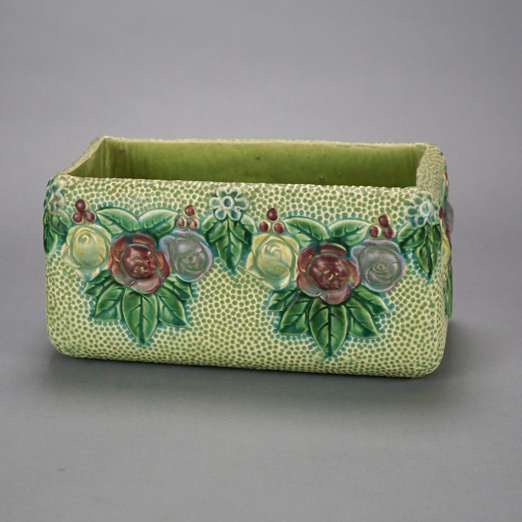 An antique Roseville Rozane window box planter offers art pottery construction with floral design, unmarked, c1920

Measures- 6''H x 12''W x 6.25''D