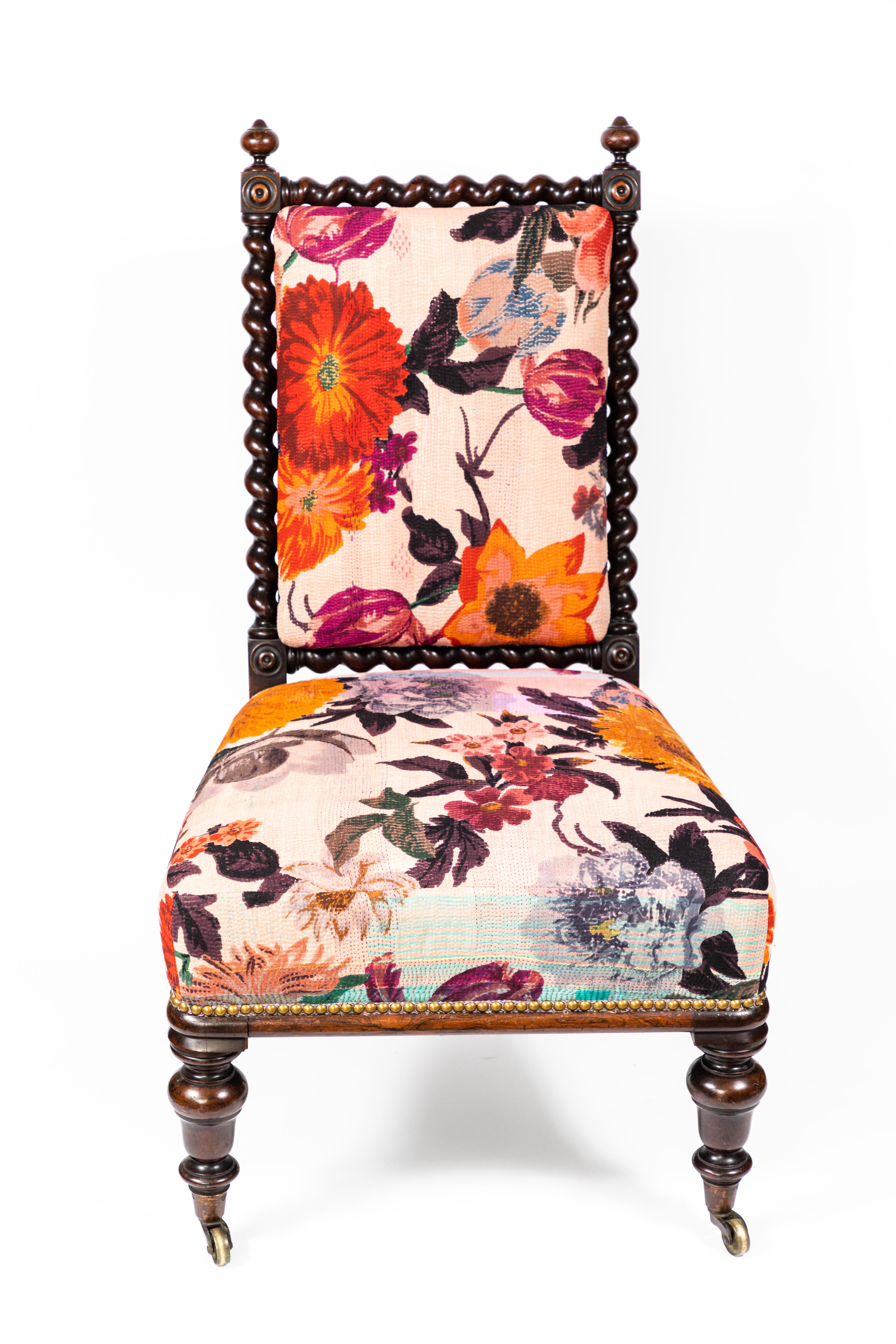 Antique rosewood barley twist slipper chair on casters. Newly upholstered in a vintage Kantha quilt that has been hand painted in a floral design.