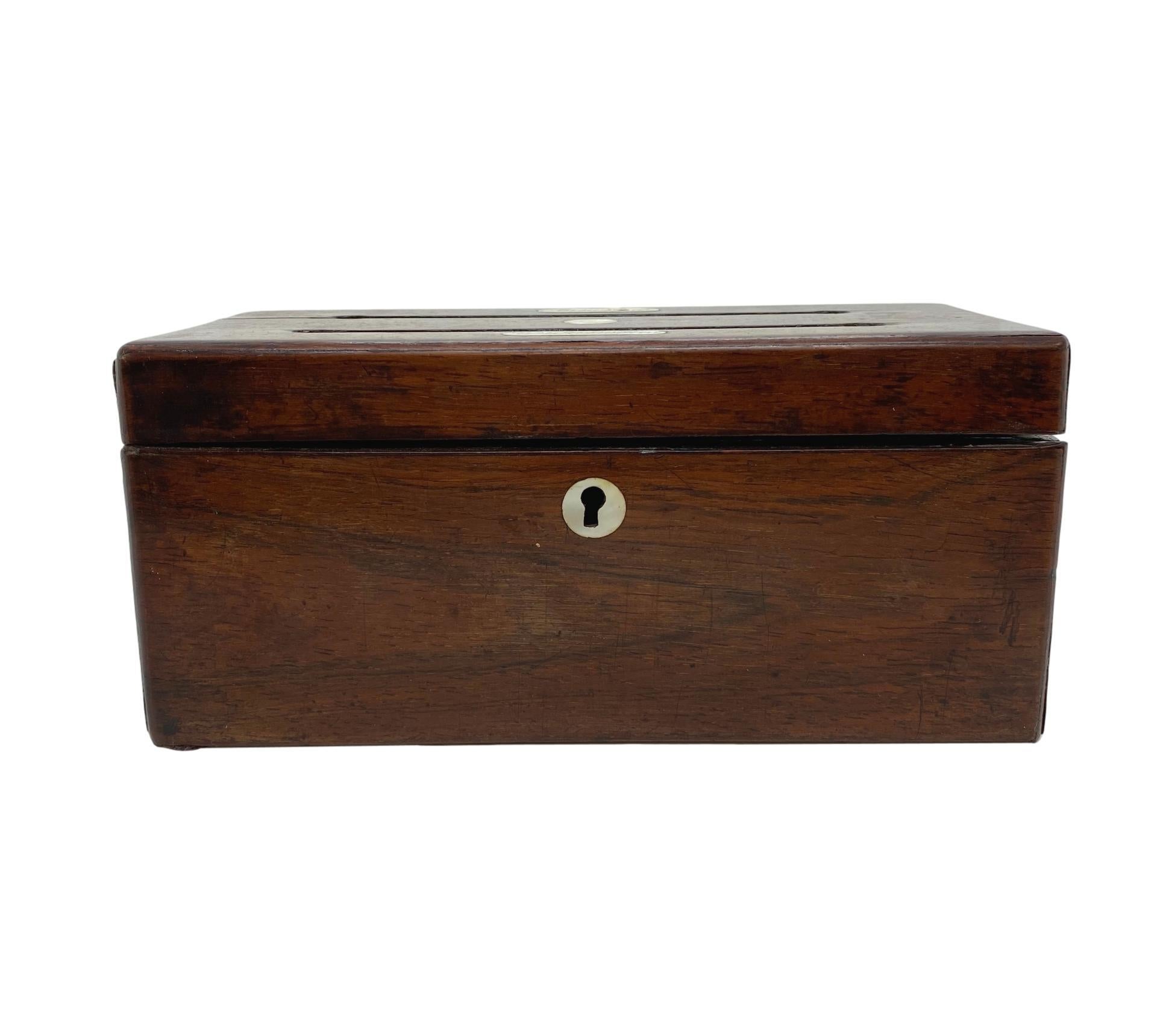 Antique rosewood letter box with mother-of-pearl escutcheon and inset plaques, inscribed 'Answered' and 'Unanswered,' English, ca. 1860.  Measurements:  H-4 x W-9 x D-4 inches.     

      