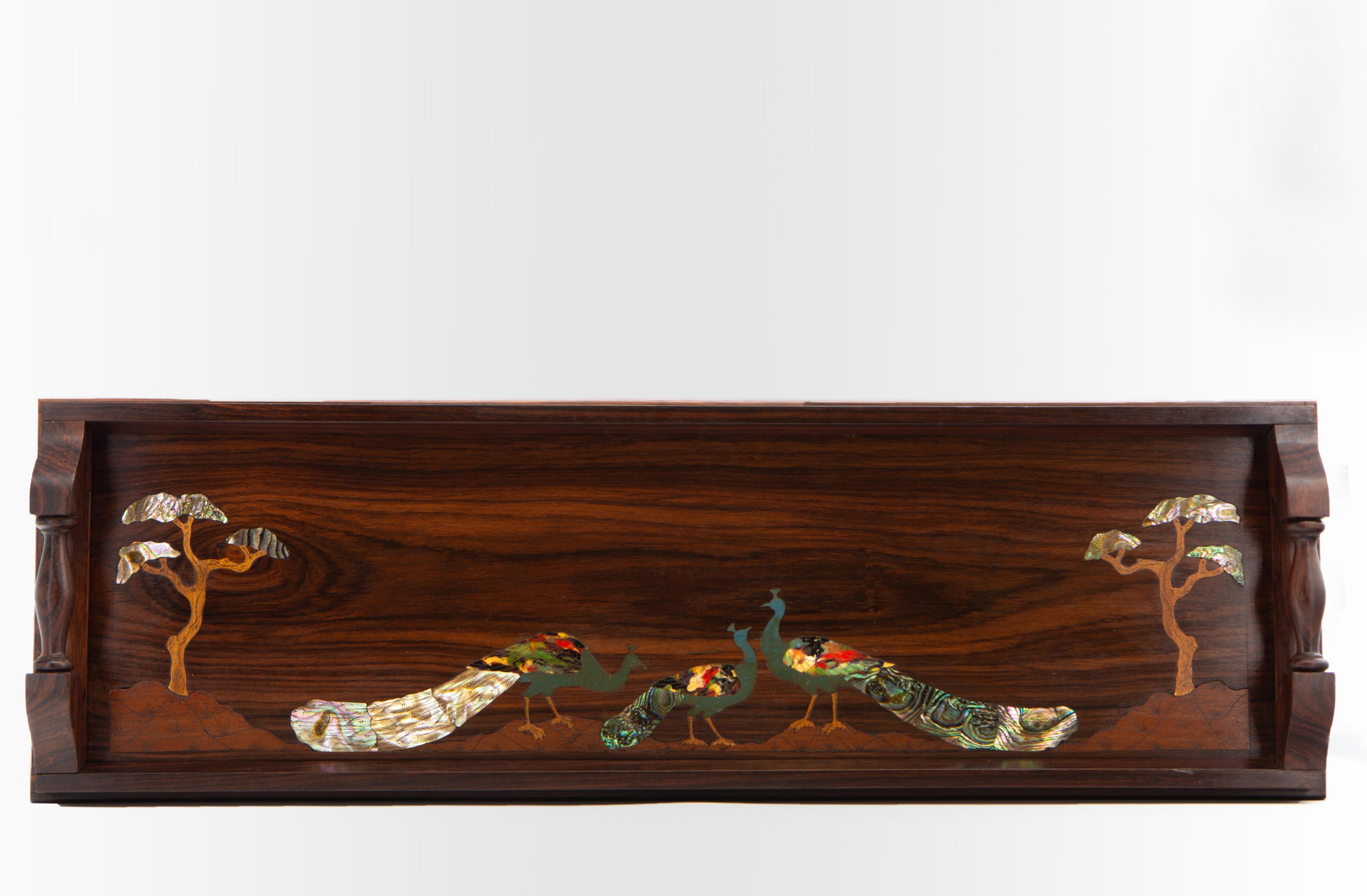 Beautiful, long antique rosewood narrow handled serving tray, inlaid in wood and mother of pearl, depicting  peacocks with trees either side. Circa 1920.  

The tray shows superb figuring in the solid rosewood grain, with the inlays jumping out, a