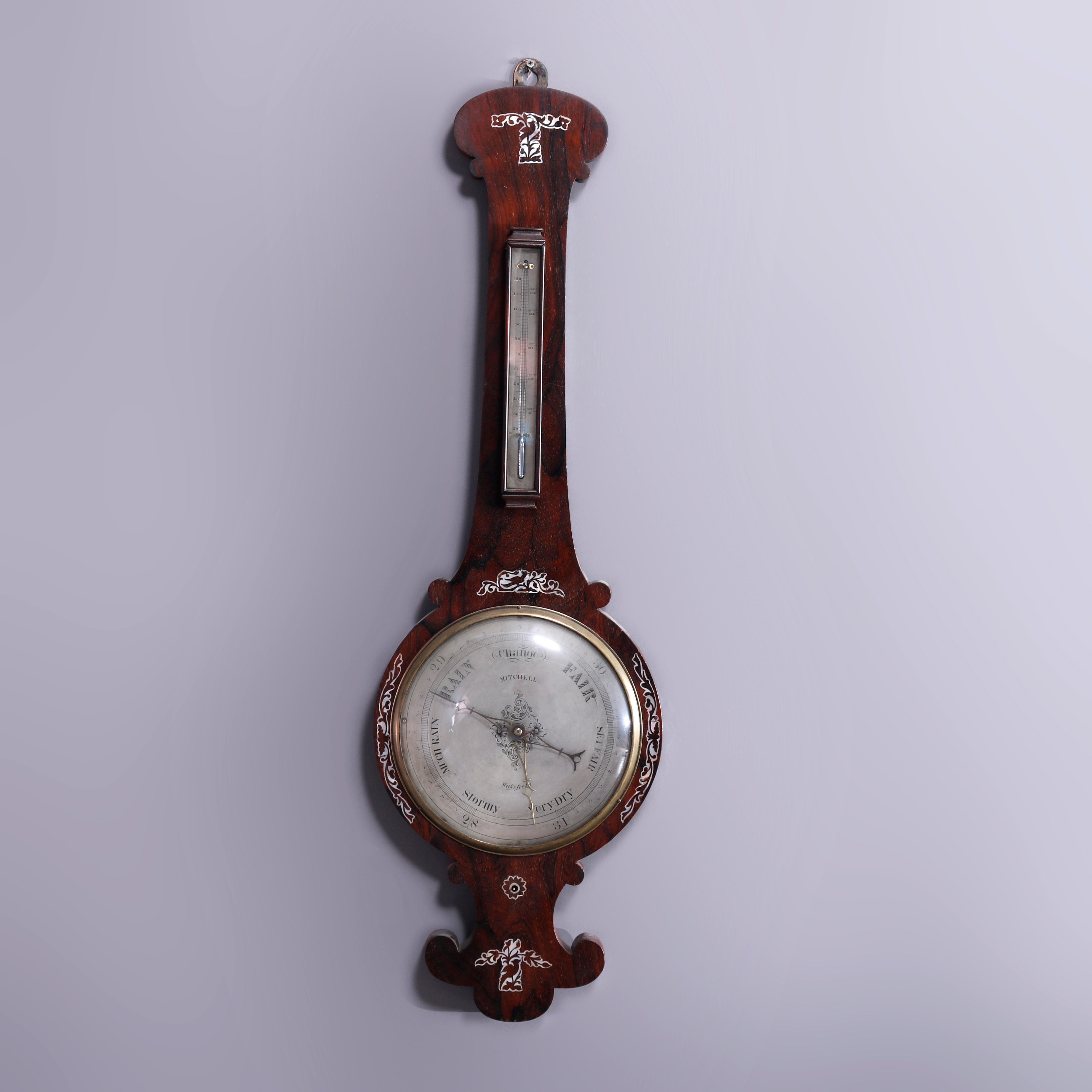 An antique barometer with thermometer by Mitchell of Wakefield, MA offers shaped rosewood case having foliate and scroll mother or pearl inlaid design, face signed with maker as photographed, c1890

Measures - 41