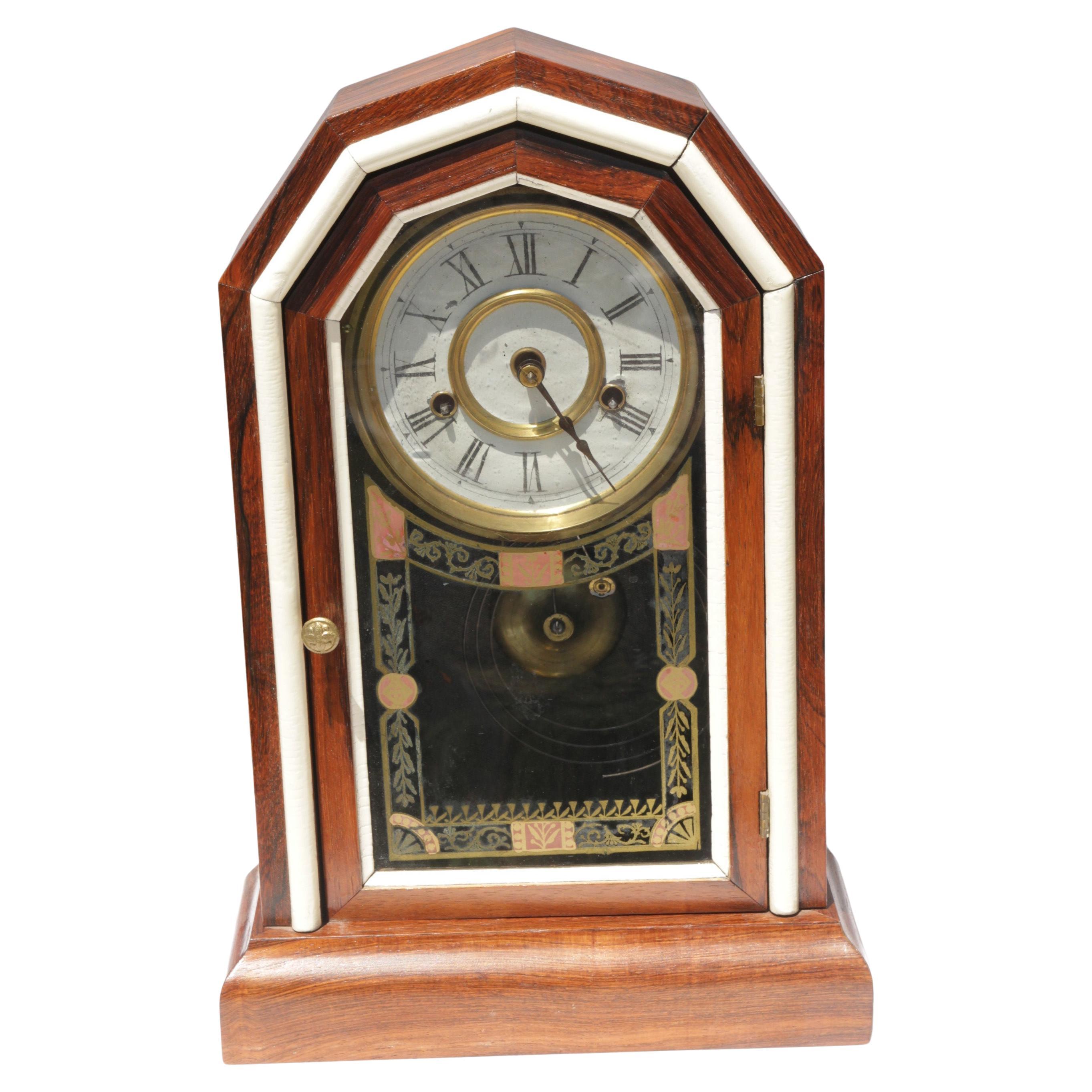 The case is done in Rosewood with white border to display a beautiful look, the glass has reverse painted design and geometrical design. 