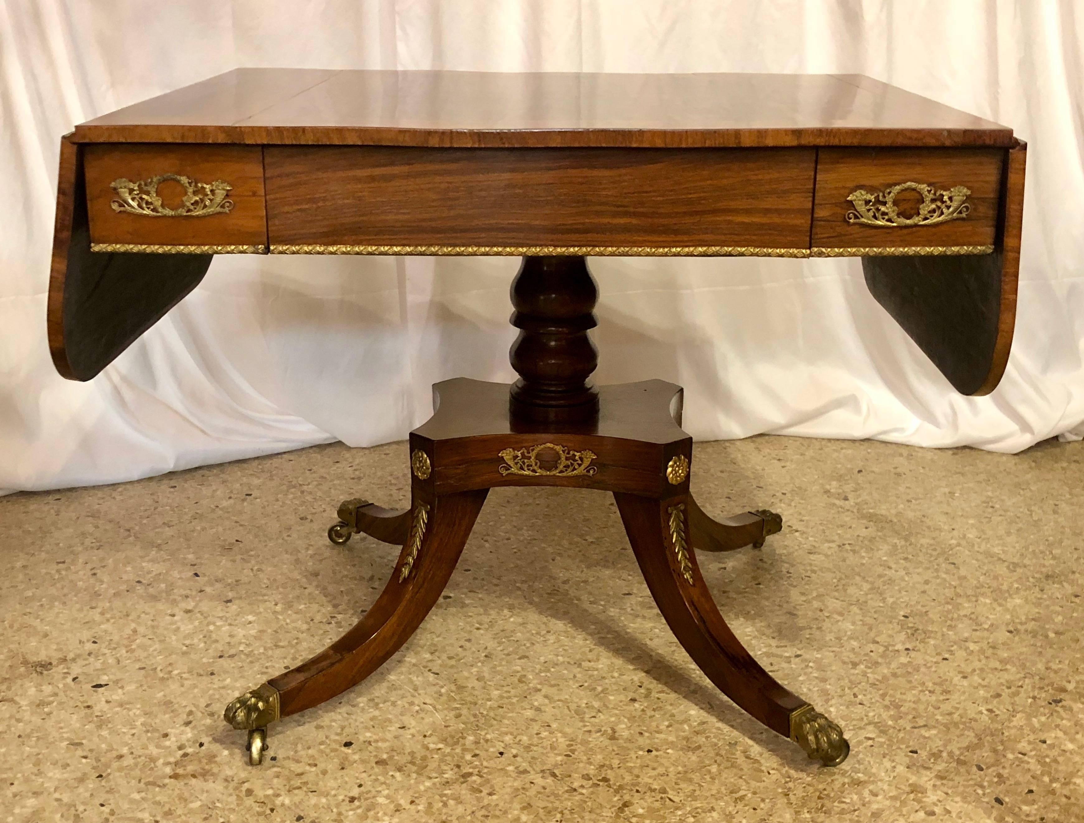 Antique rosewood Regency sofa table with satinwood trim, circa 1830-1840. This handsome table would make a wonderful addition any home. Rosewood is a magnificent wood.