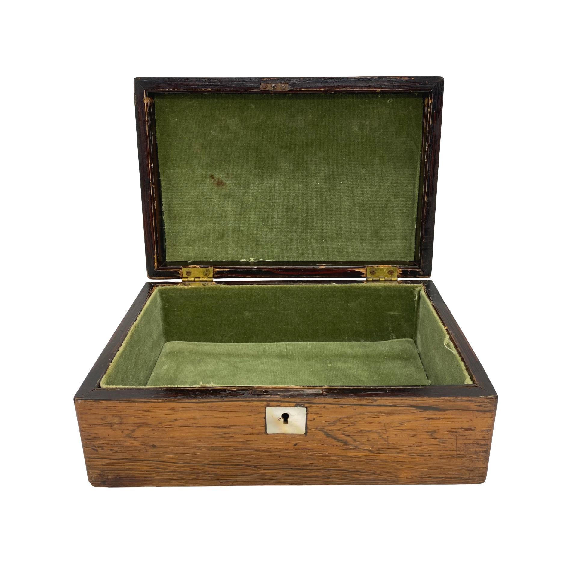 Antique rosewood stationery box with fine inlaid mother of pearl flowers, the central inset plaque inscribed, 'Annie,' English, circa 1840.

           