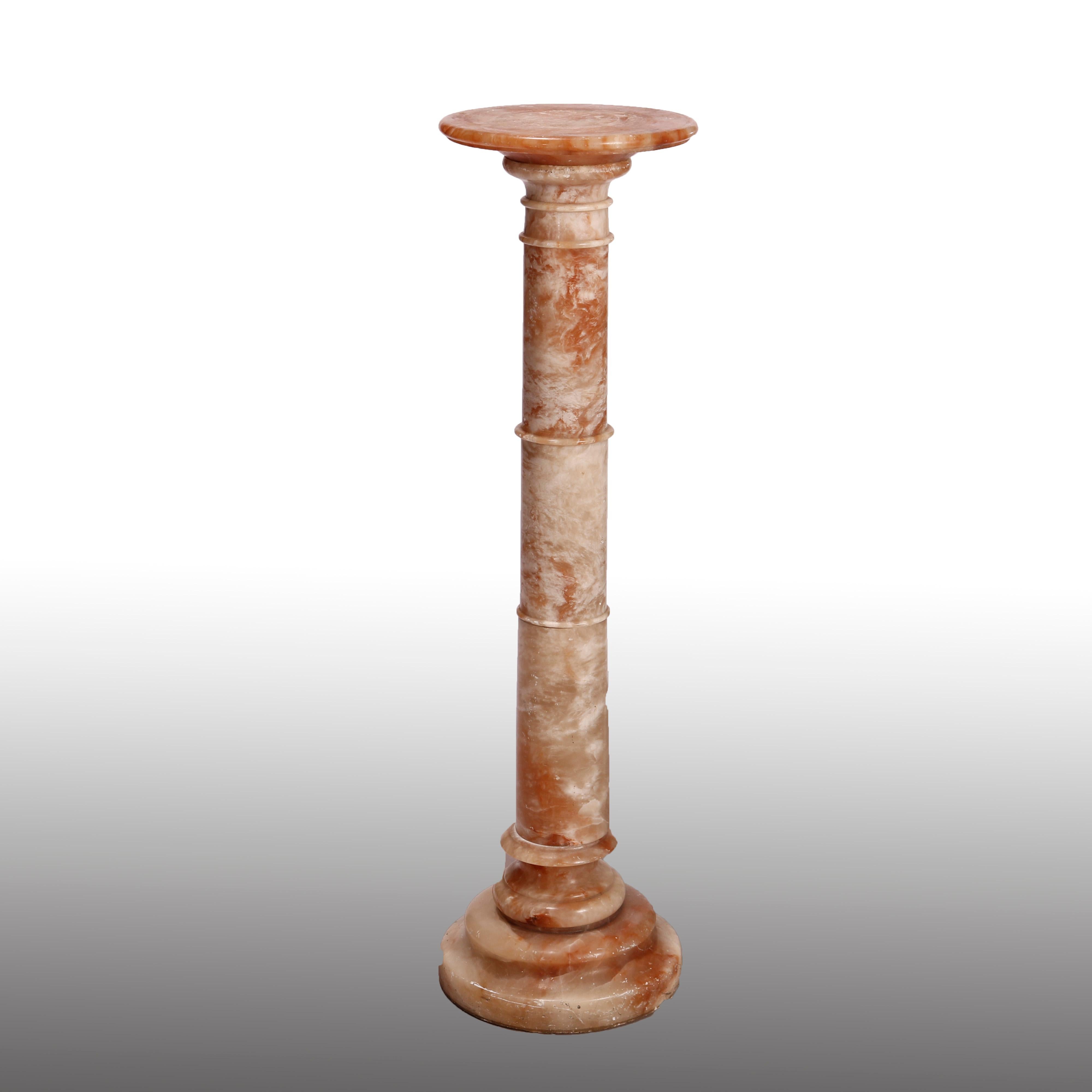 An antique sculpture pedestal offers rouge marble construction in Doric form with round display and stepped base, c1890

Measures- 38.25''H x 10.5''W x 10.5''D.