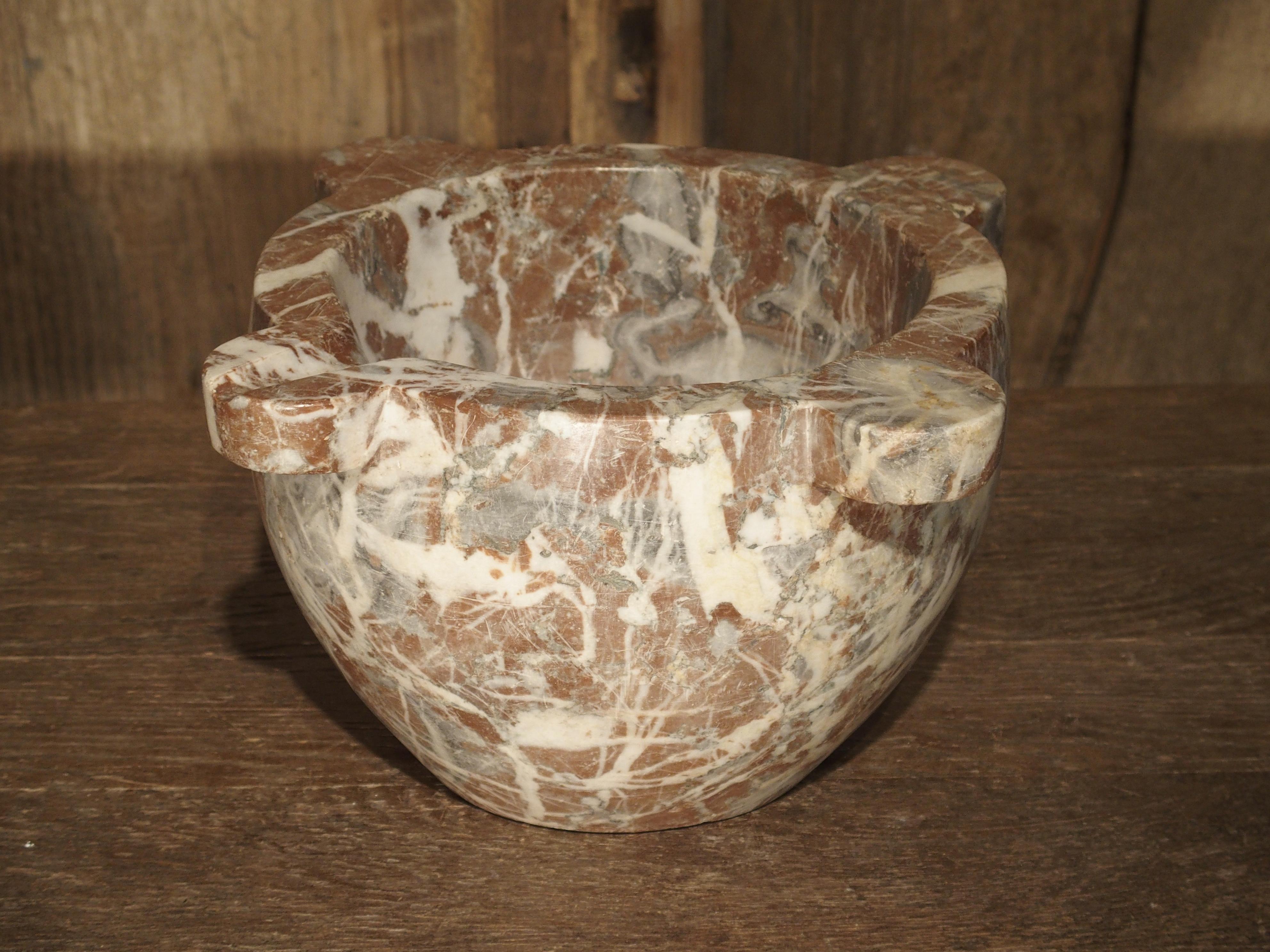 From France, this beautifully veined rouge marble mortar dates to the mid-1800s. Mortar and pestles have been essential since ancient times. They are used for the crushing of foods and medicines, and can be found in a variety of materials, including