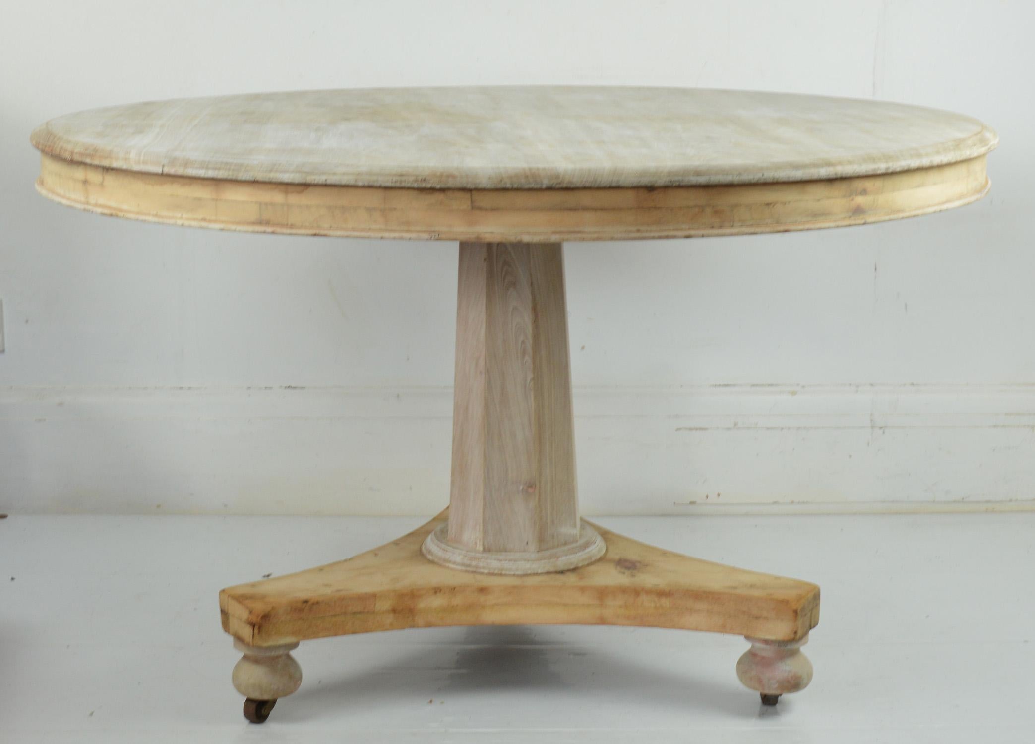 Fabulous small round table. Made from bleached Honduras mahogany and pine.

Beautifully figured top.

On the original castors. The top tips so the table can be pushed to the side of the room.

I have chosen not to lacquer or wax the