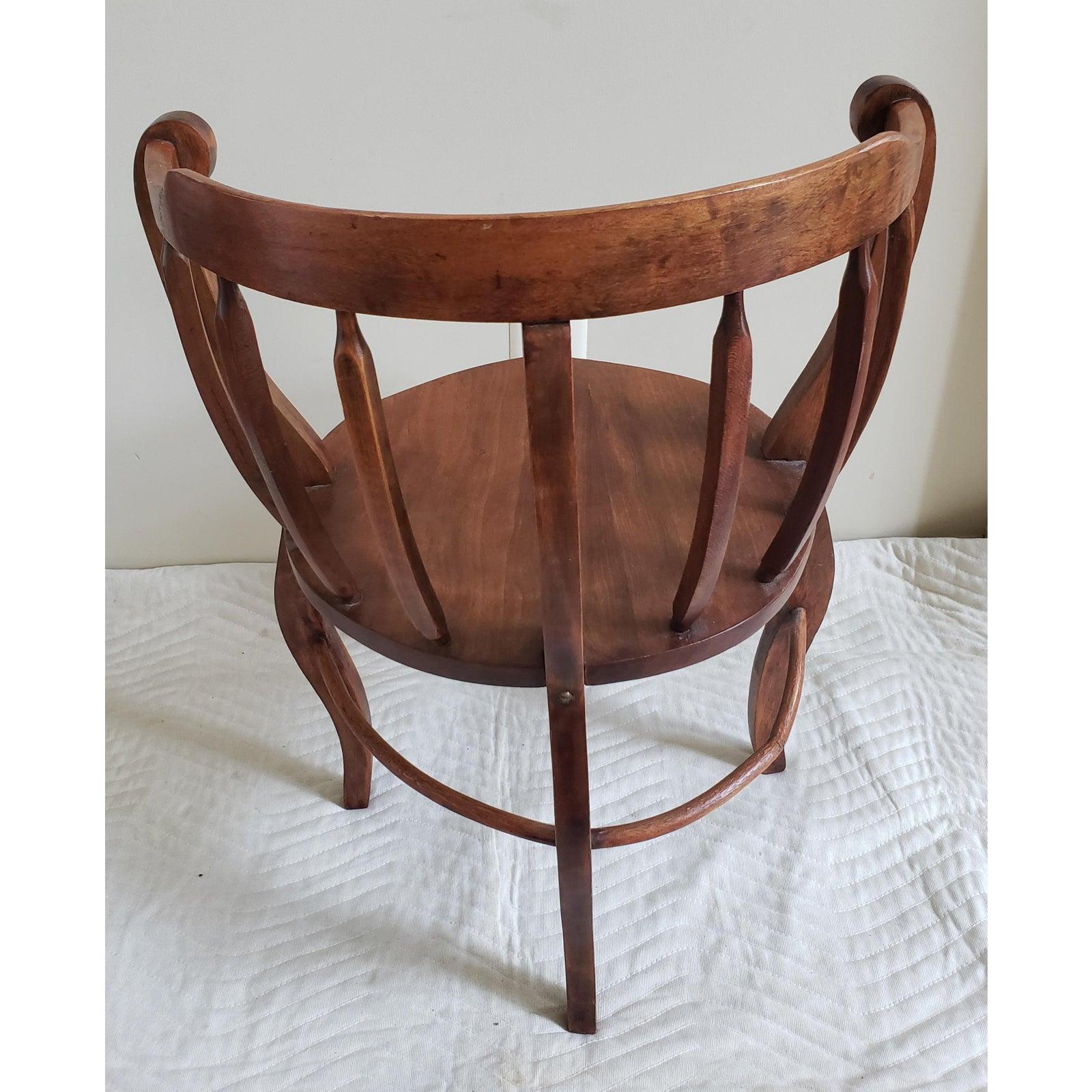 Antique round chair with vine connecting legs. Good vintage condition. Chair measures 23 W x 20 D x 30 H.
    