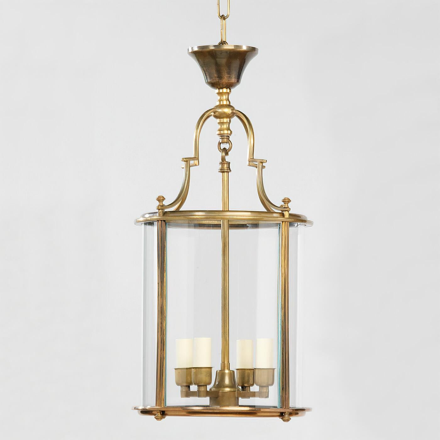Simple in style and inspired by a 17th-century antique, this lantern features fine decorative details, from the crown at the top, to the finials on its underside. Handcrafted from brass and glass and is beautifully cast

Dimensions: 11