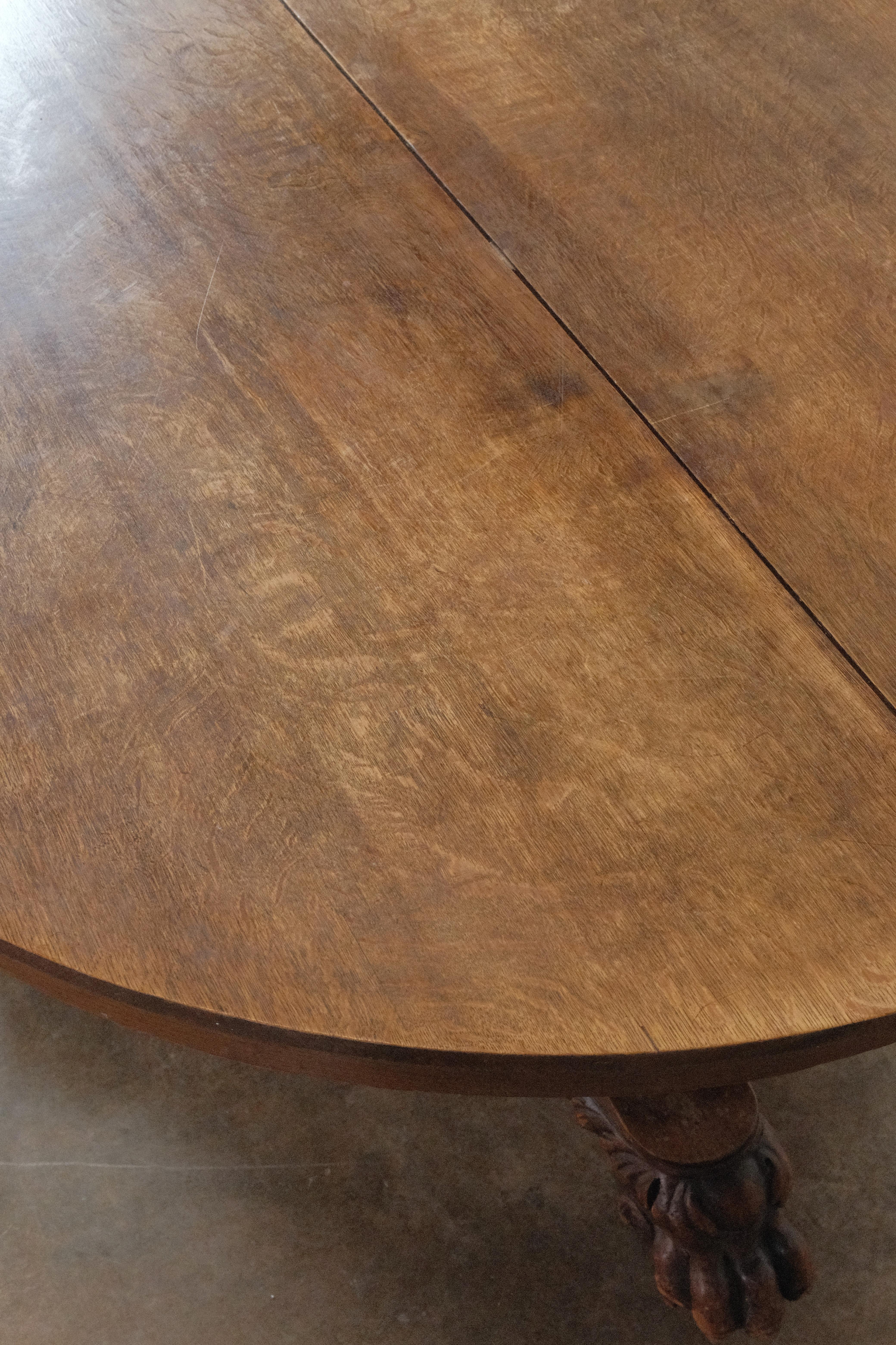 antique round oak table with claw feet