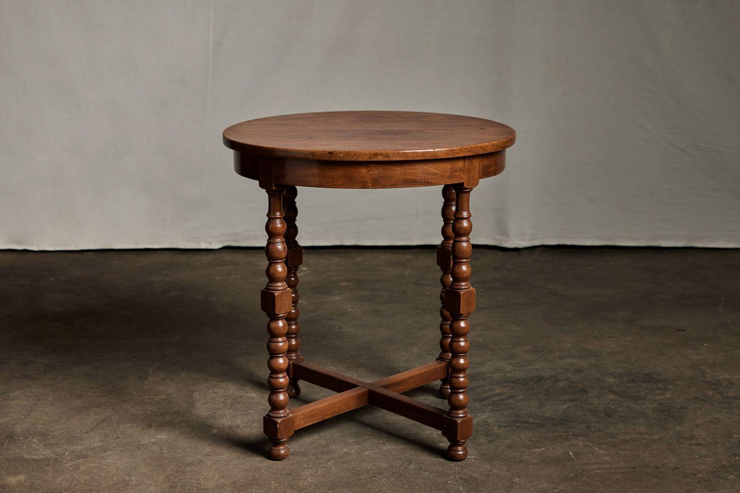 Antique round occasional table. Turned legs. Teak hardwood. Tropical-Dutch, Indonesia. Circa 1920.