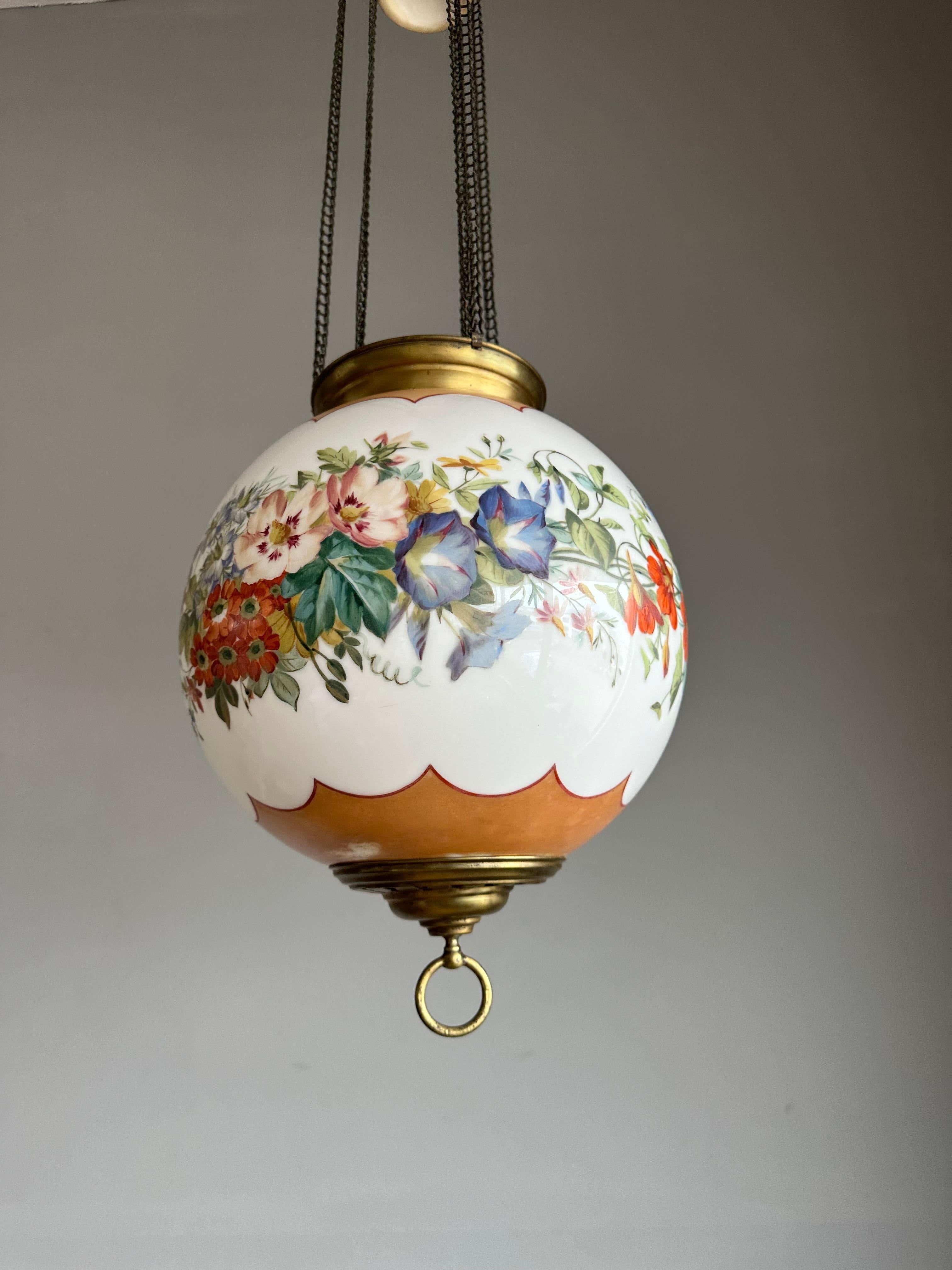 Wonderful design, antique pendant Light with brass gallery with colorful wreath of flowers decor, late Victorian 1900s.

If you are looking for a rare, beautifully designed and finely decorated pendant to grace your entrance, landing or perhaps your