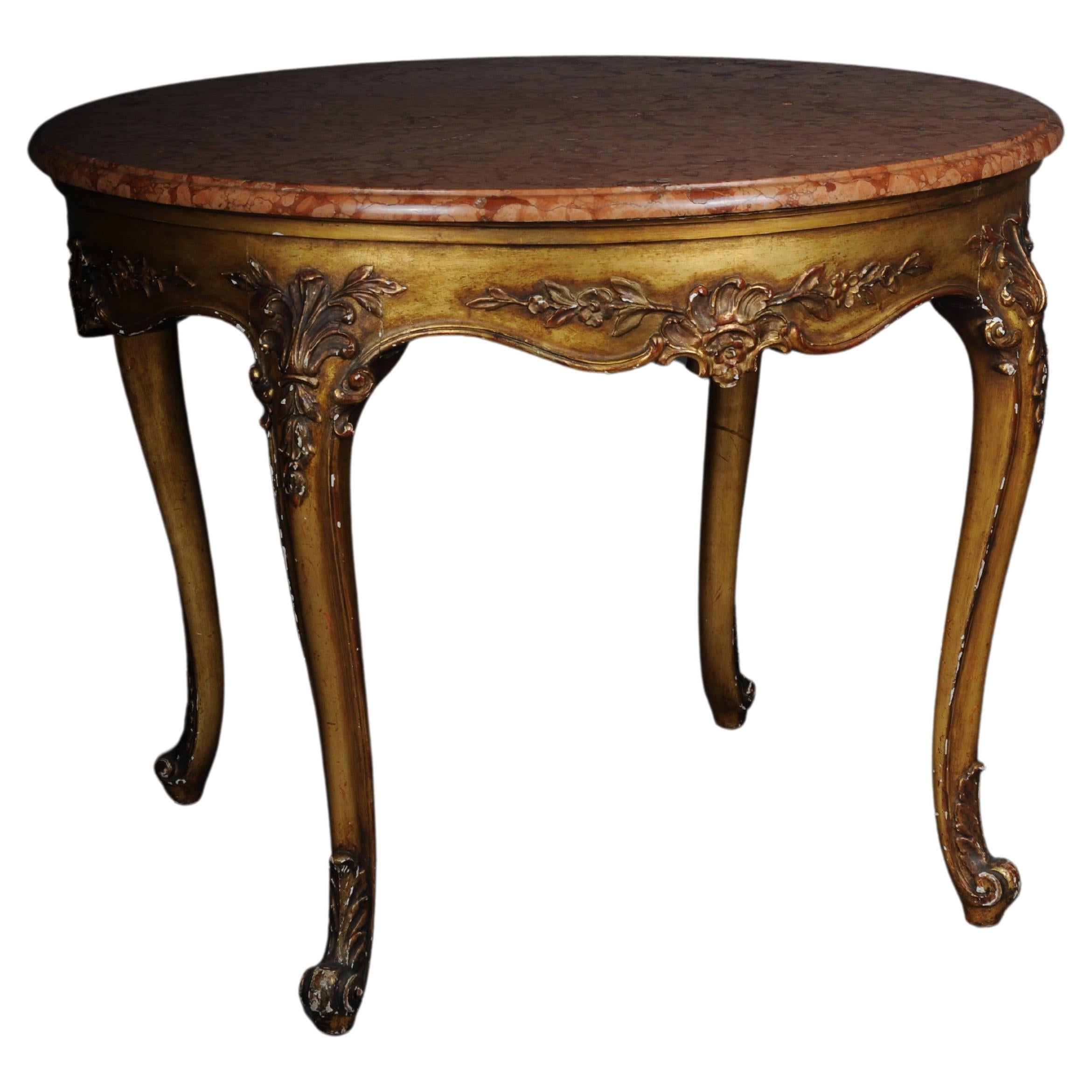 Antique round salon table, Louis XV circa 1900. Gold with marble top

Solid wood body, richly decorated and completely gold-plated. Curved legs with multi-pass curved cornice. France Louis XV style around 1900.
Round, profiled marble slab.

Very