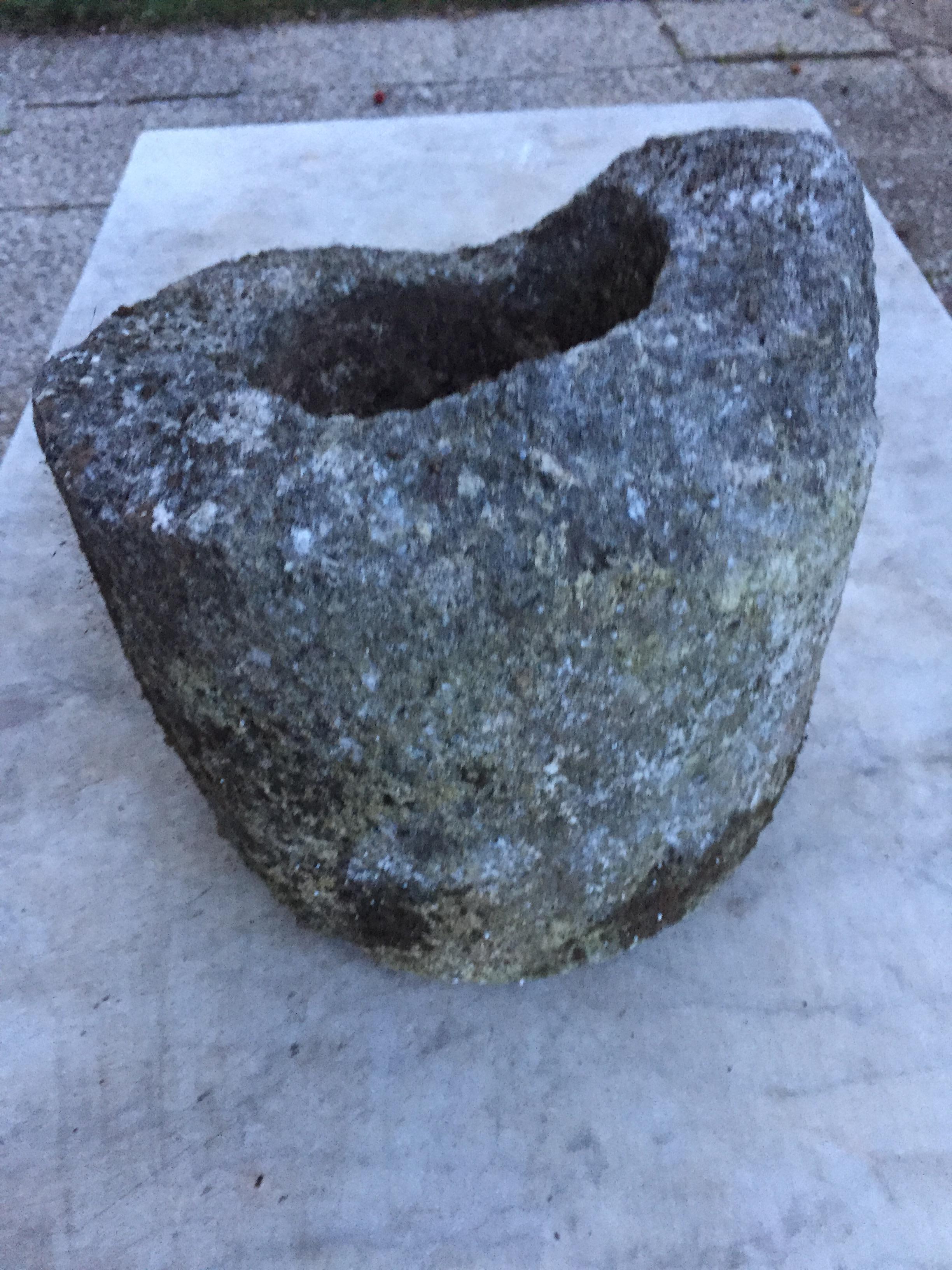 Antique round trough or planter cast stone. Probablly at some time was turned into a planter, as it has a hole in the bottom.