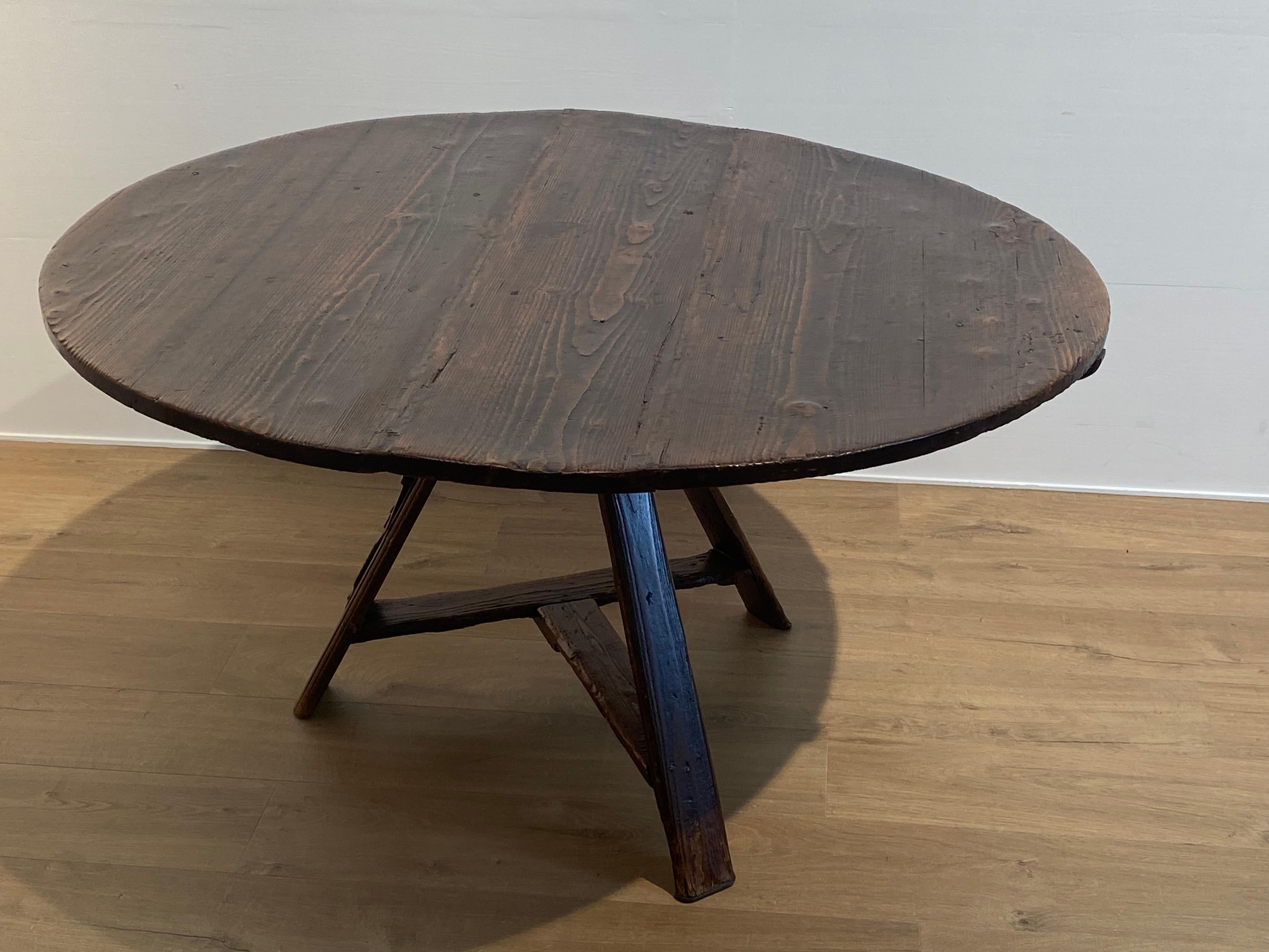 Patinated Antique round tripod Farmers Table For Sale
