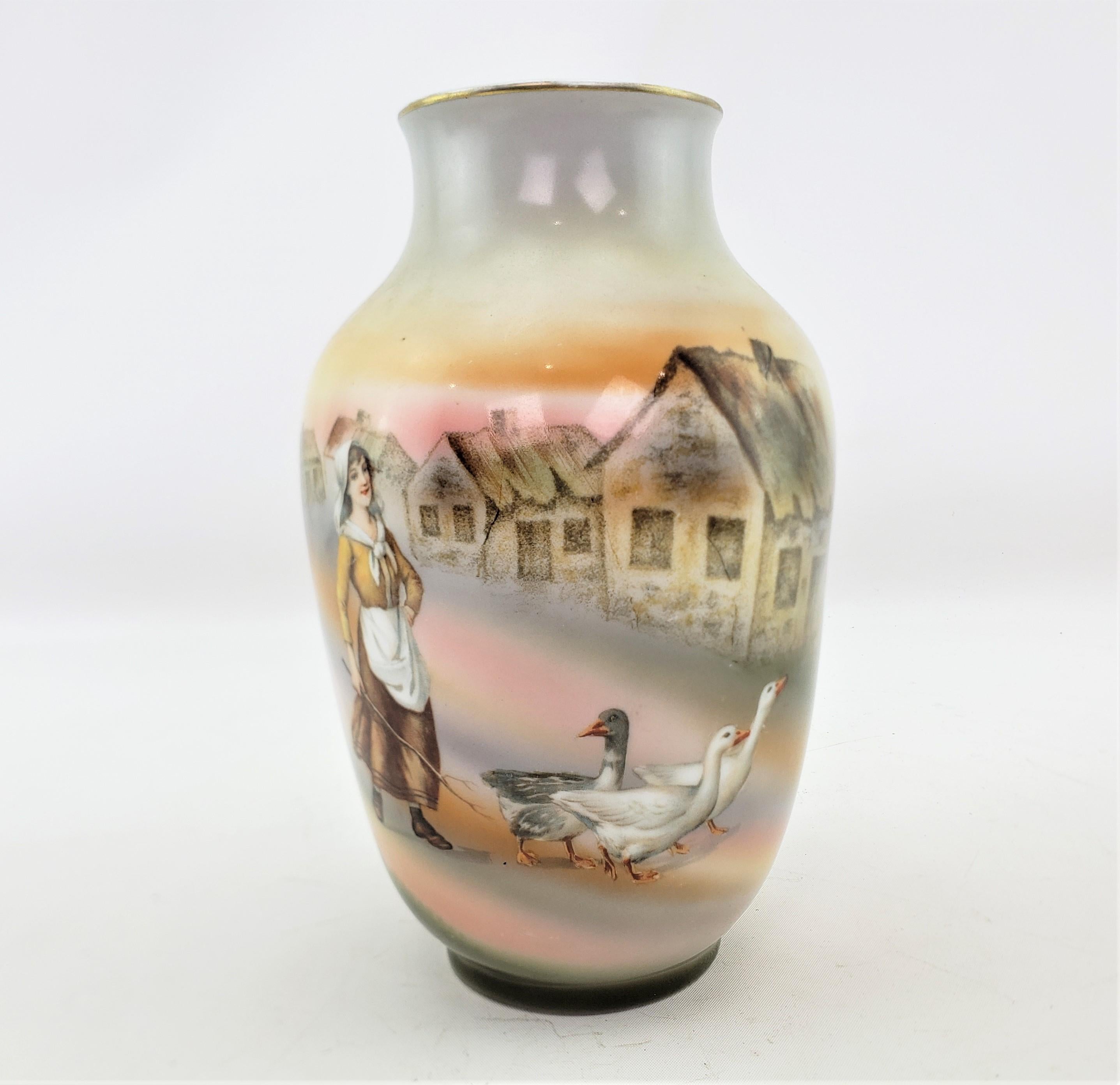 This antique vase was made by the well known Royal Bayreuth factory of Bavaria in approximately 1920 in a period Art Deco style. The vase is composed of porcelain and has a hand-painted vignette of a young woman walking through a rustic village