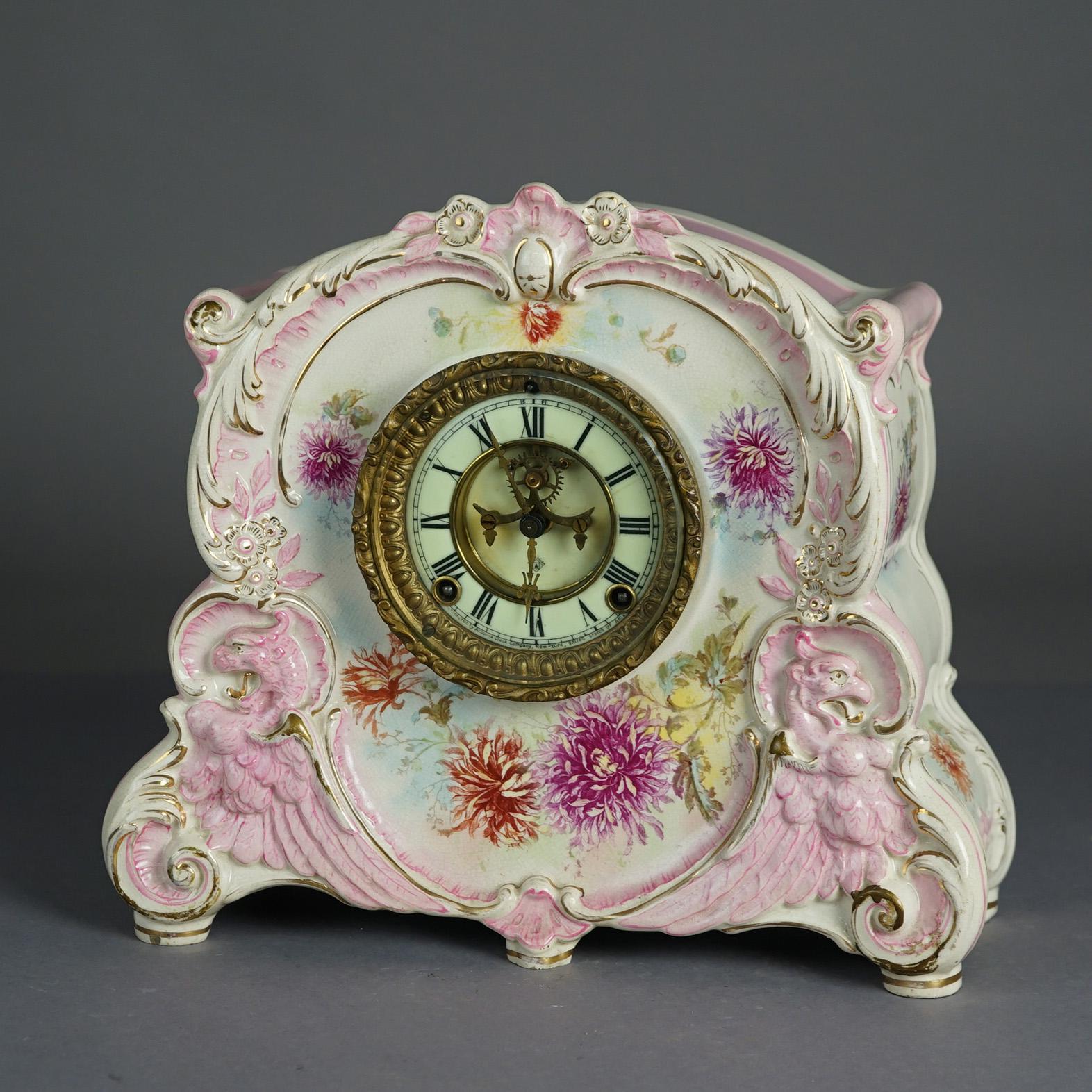 An antique Royal Bonn La Corsica mantel clock offers shaped porcelain construction with hand painted floral decoration with gilt highlights and an open escapement; en verso signed as photographed; 19th century

Measures - 12