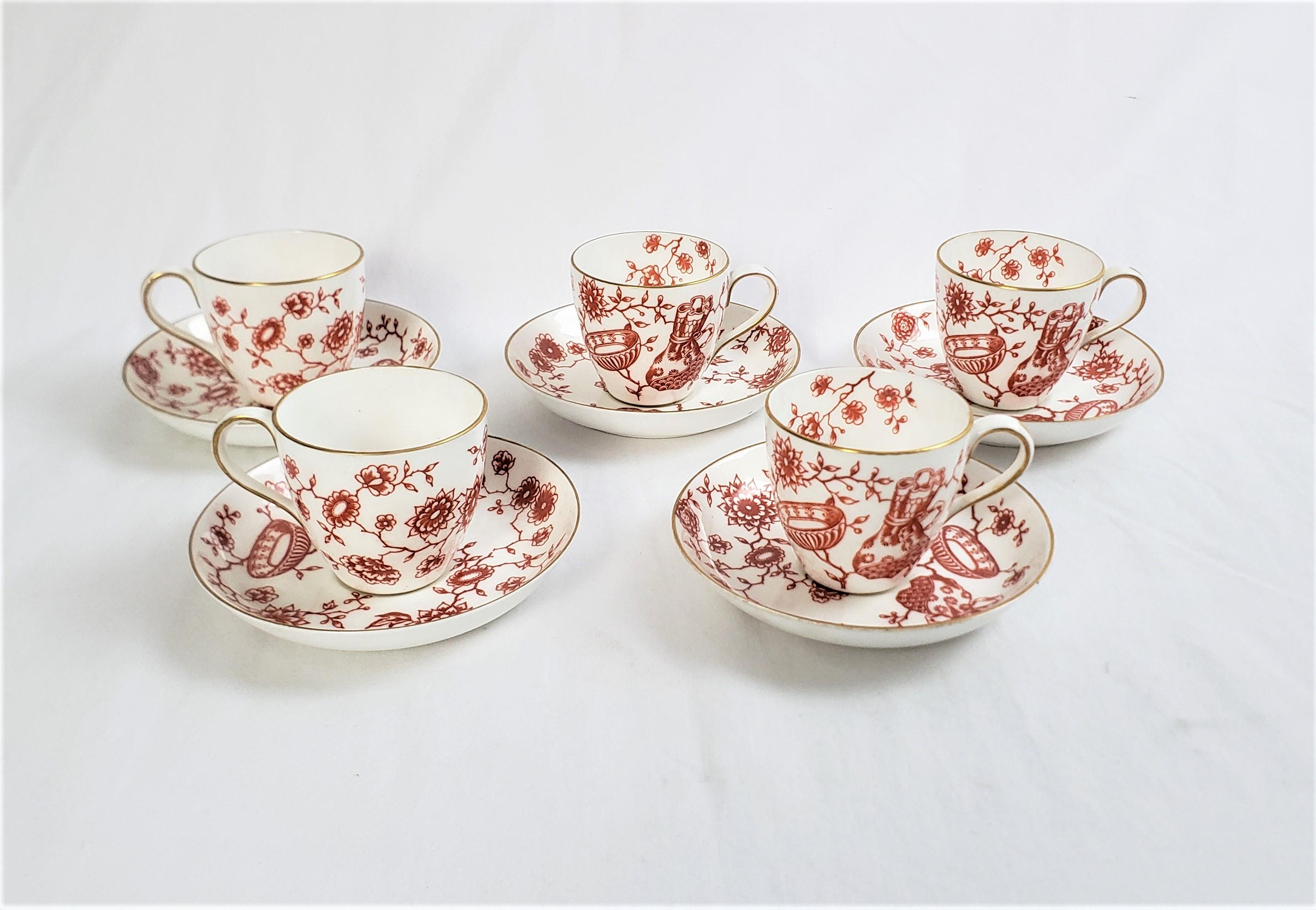 These five small cup and saucer sets, and one additional saucer, were made by the well known Royal Crown Derby maker of England and date to approximately 1850 and done in the period Chinoiserie style. These cup and saucer sets are composed of