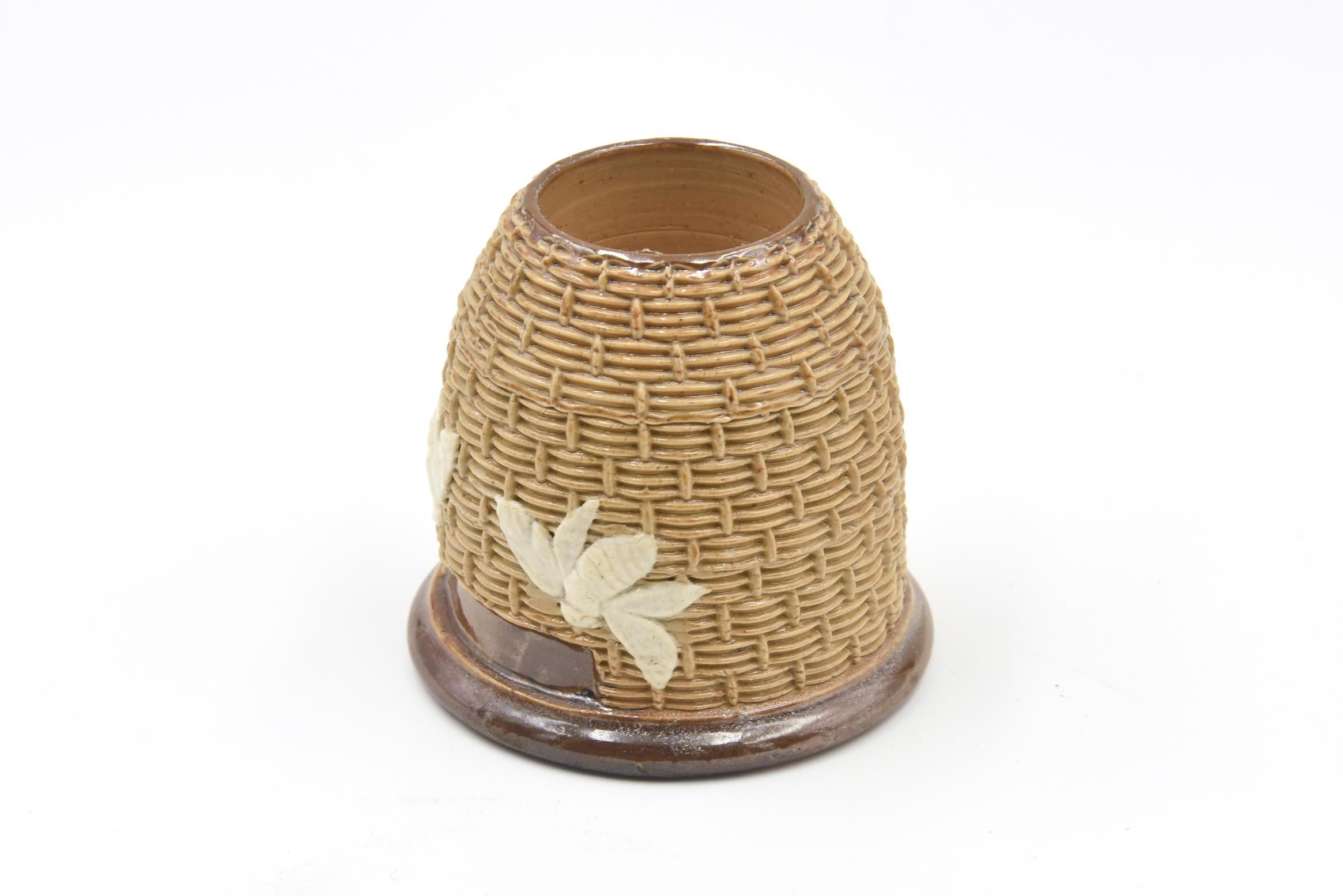 Impressed basketweave design, with applied relief bumblebees. 
Featured in 