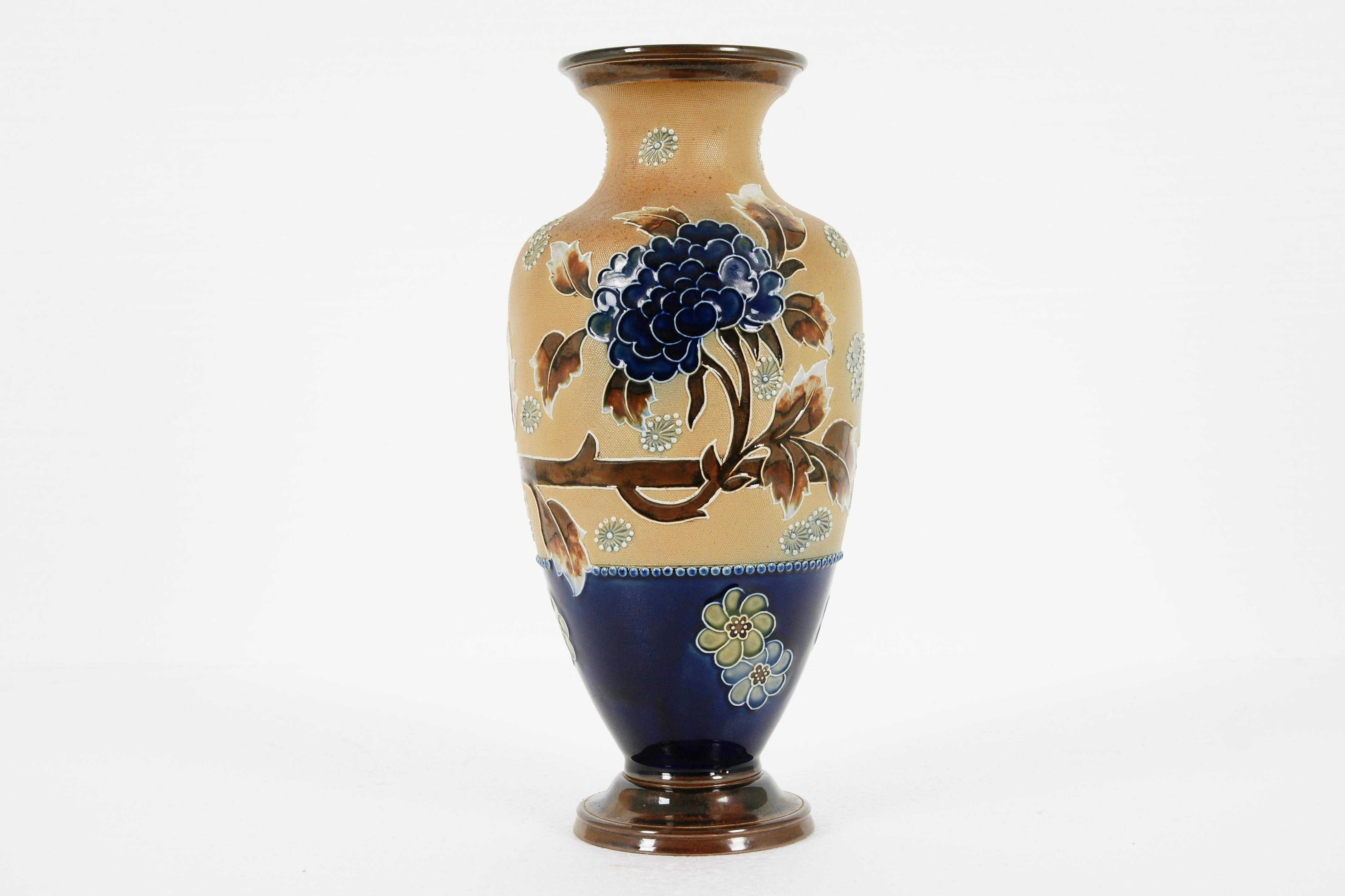 Antique Royal Doulton, slater stoneware vase, B1982

Art Nouveau floral pattern
Blue flowers
Royal Doulton marks underneath
Doulton Slater mark

B1982

Size: 6