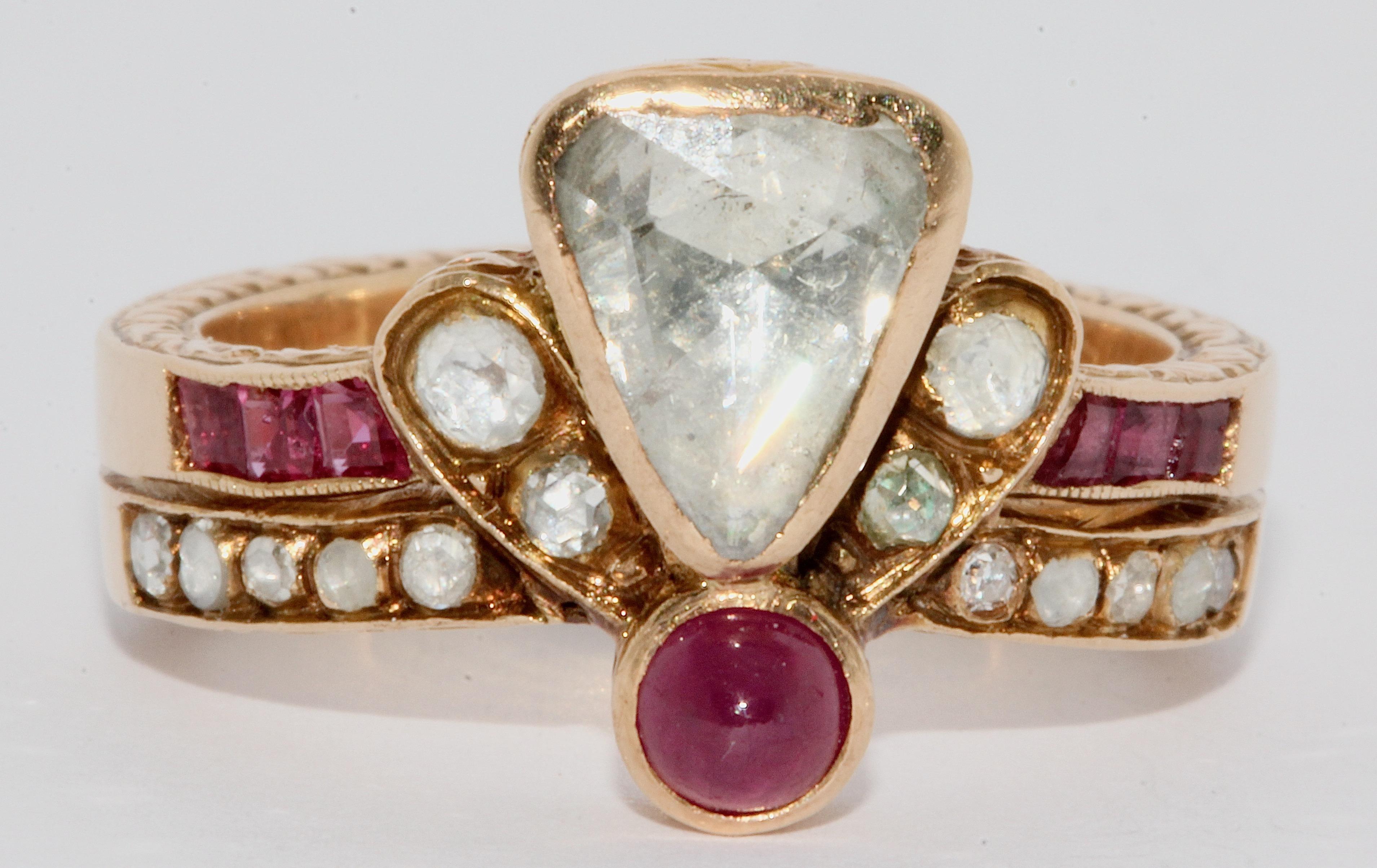 Magnificent, antique, royal gold ring with rose cut diamond, rubies and ornaments.

Ring set with a large rose-cut diamond of approximately 2 carat, additional diamonds and rubies.

The front and back of the ring setting is intricately
