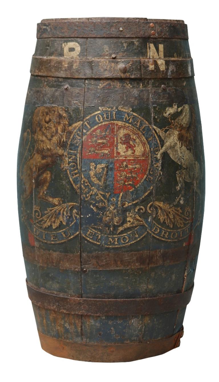 An early 19th century Royal Navy coopered rum or water cask, painted with the British Royal coat of arms. Later adapted into a stick or umbrella stand.