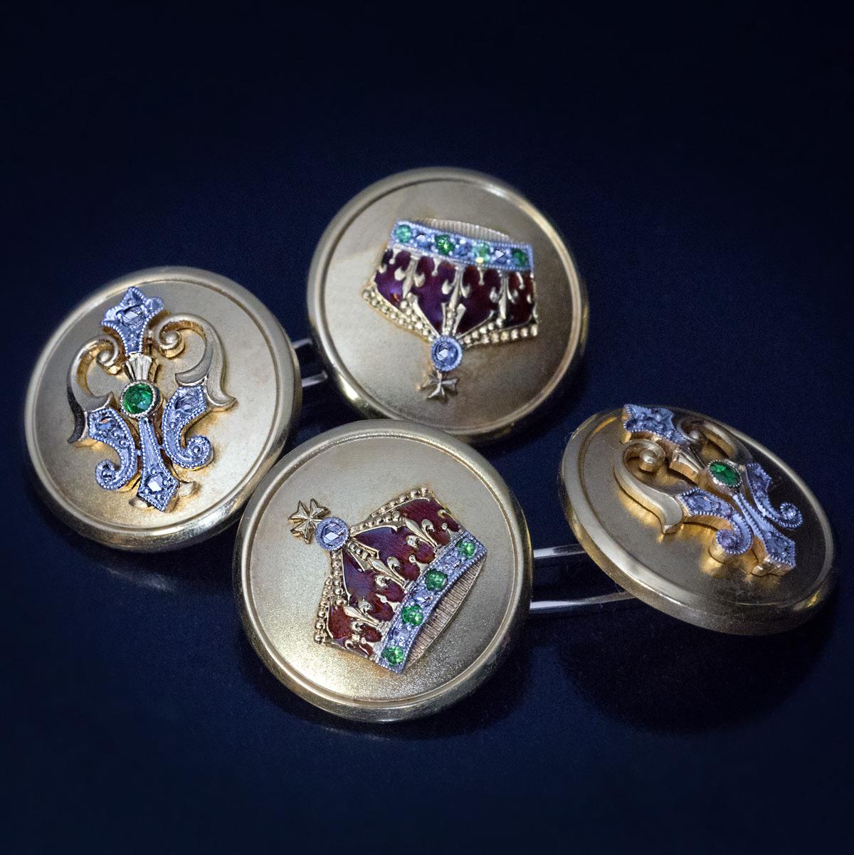 Circa 1908

A pair of royal presentation cufflinks is crafted in platinum and matte 14K yellow gold. The cufflinks are decorated with royal red enamel crown and cipher of king Ferdinand I (Cyrillic letter ‘Ф’) designed in Art Nouveau taste. Both the