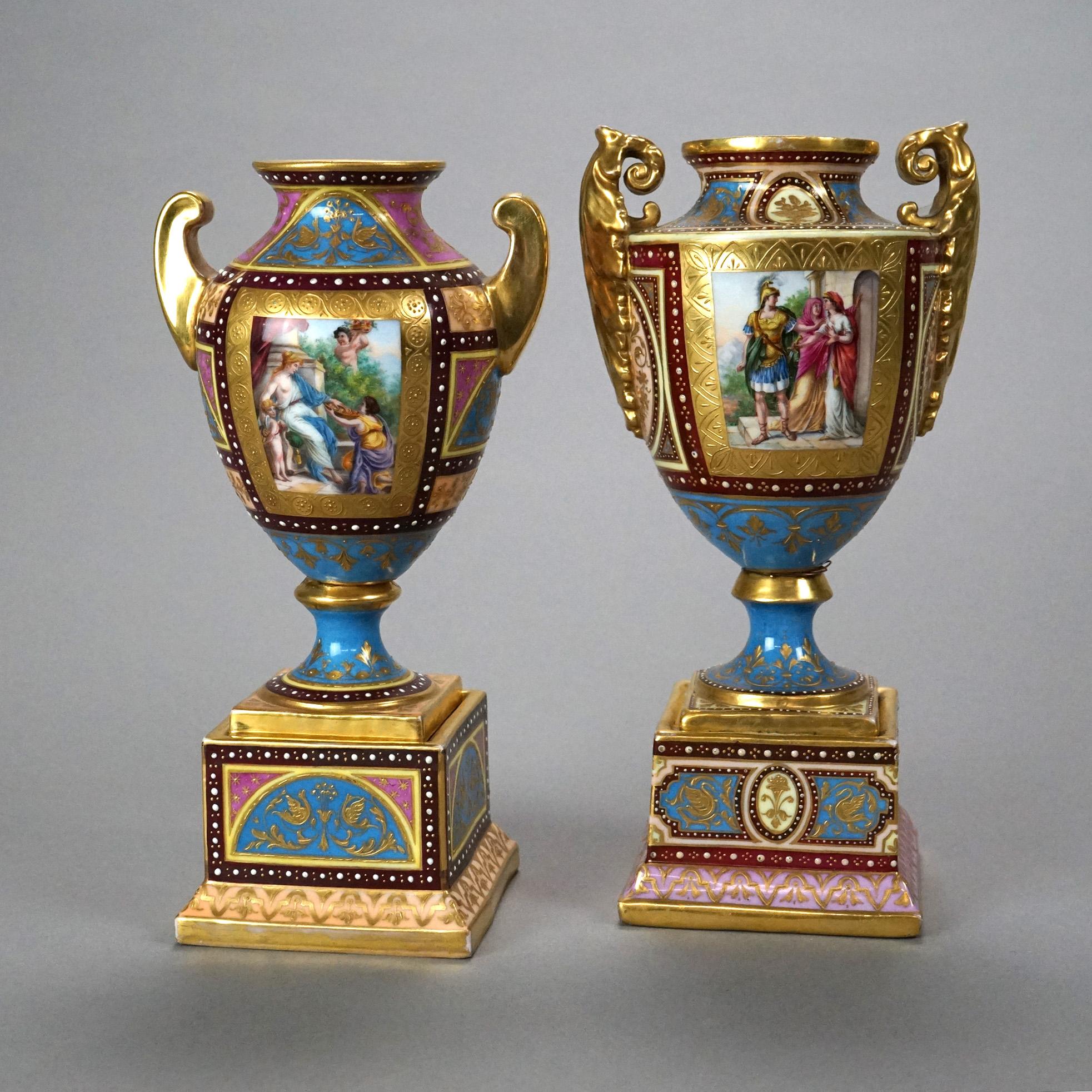 An antique pair of Austrian Royal Vienna urns offer porcelain construction with hand painted genre scenes, gilt highlights, double handles and beehive shield maker mark on base as photographed, c1890

Measures- larger 8.5''H x 4.25''W x 3.5''D;