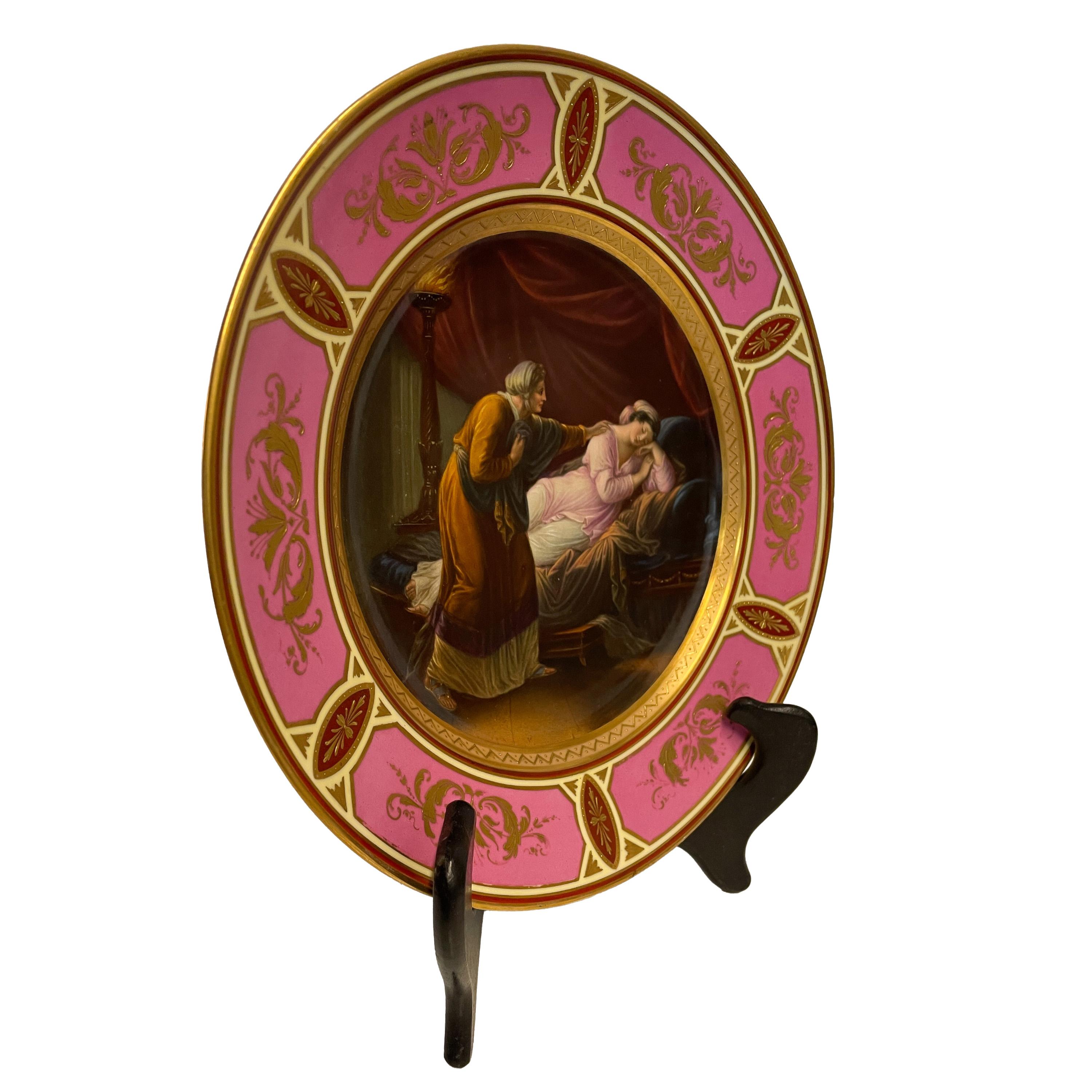 A fine antique Austrian Royal Vienna handpainted & gilded porcelain cabinet plate, circa 1890.

To the center of the plate is a handpainted scene of Odysseus's wife Penelope being awakend by Odysseus's nurse Eurycleia, the scene taken from Homer's
