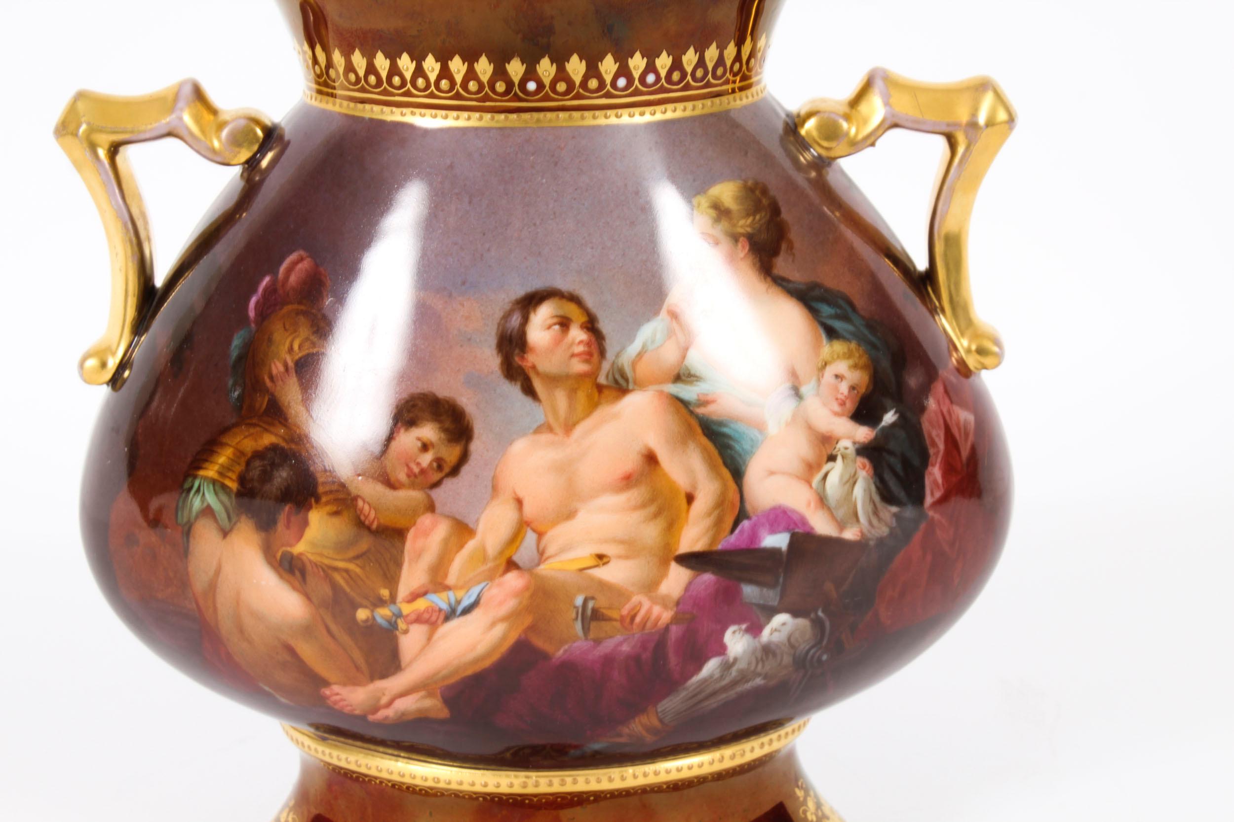 A superb quality and very beautiful antique Vienna Porcelain  hand painted two-handled vase,  Circa 1880 in date.

Painted with a mythological figural group scene on one side, and playful cherubs on the other. All on a stunning gilded ox-blood red