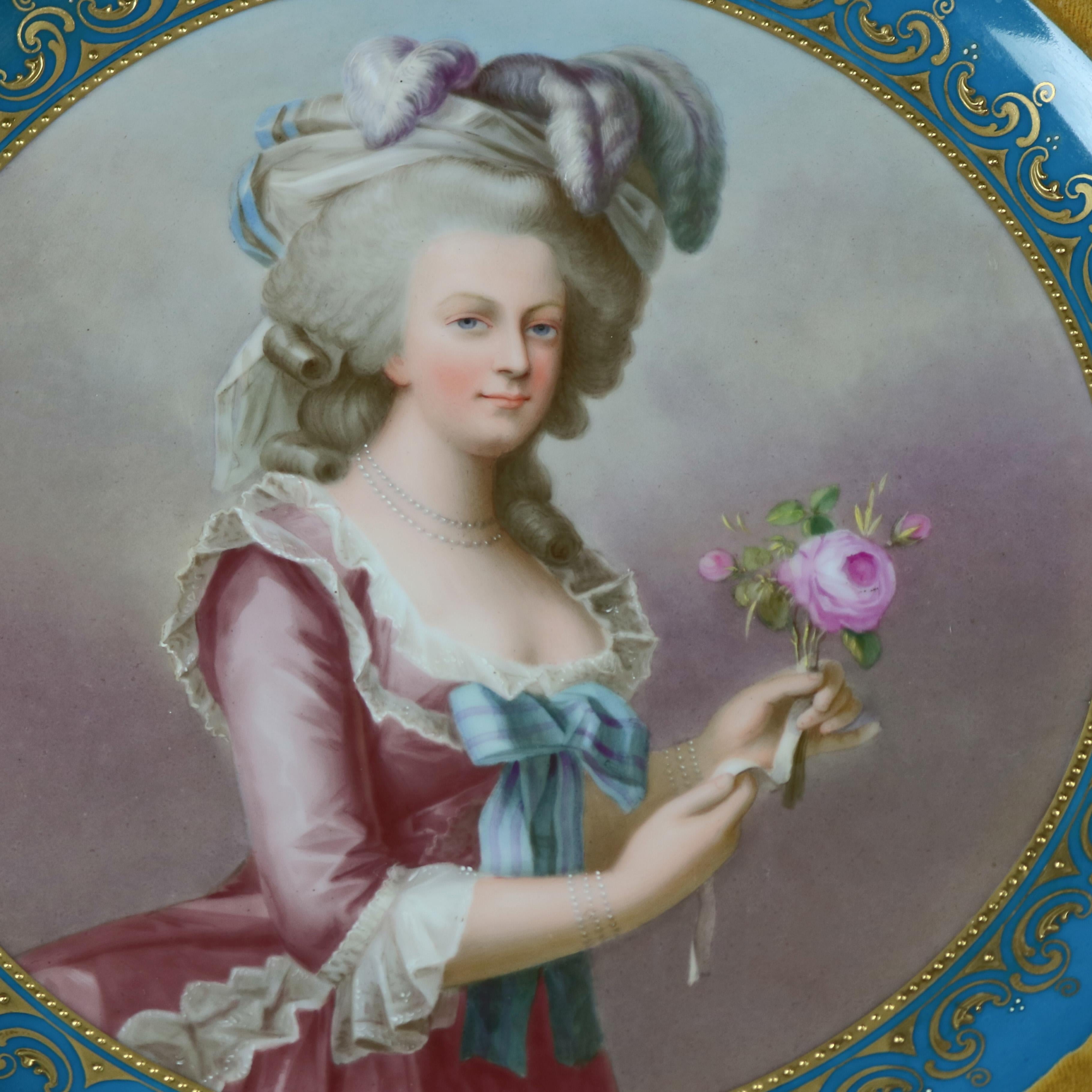 An antique Royal Vienna Porcelain plate/plaque depicts hand painted and artist-signed portrait of Marie Antoinette with gilt decorated rim and seated in giltwood and velvet frame, circa 1890.

Measures: 20