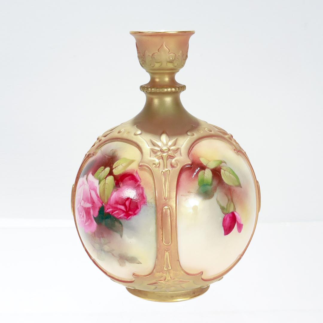 A fine antique porcelain flower vase.

By Royal Worcester.

Model no. F126/H.

Designed by James Hadley.

Of a bulbous form with blush decorated highpoints and cartouches with hand painted roses.

Fully marked to the base.

Date:
Early 20th