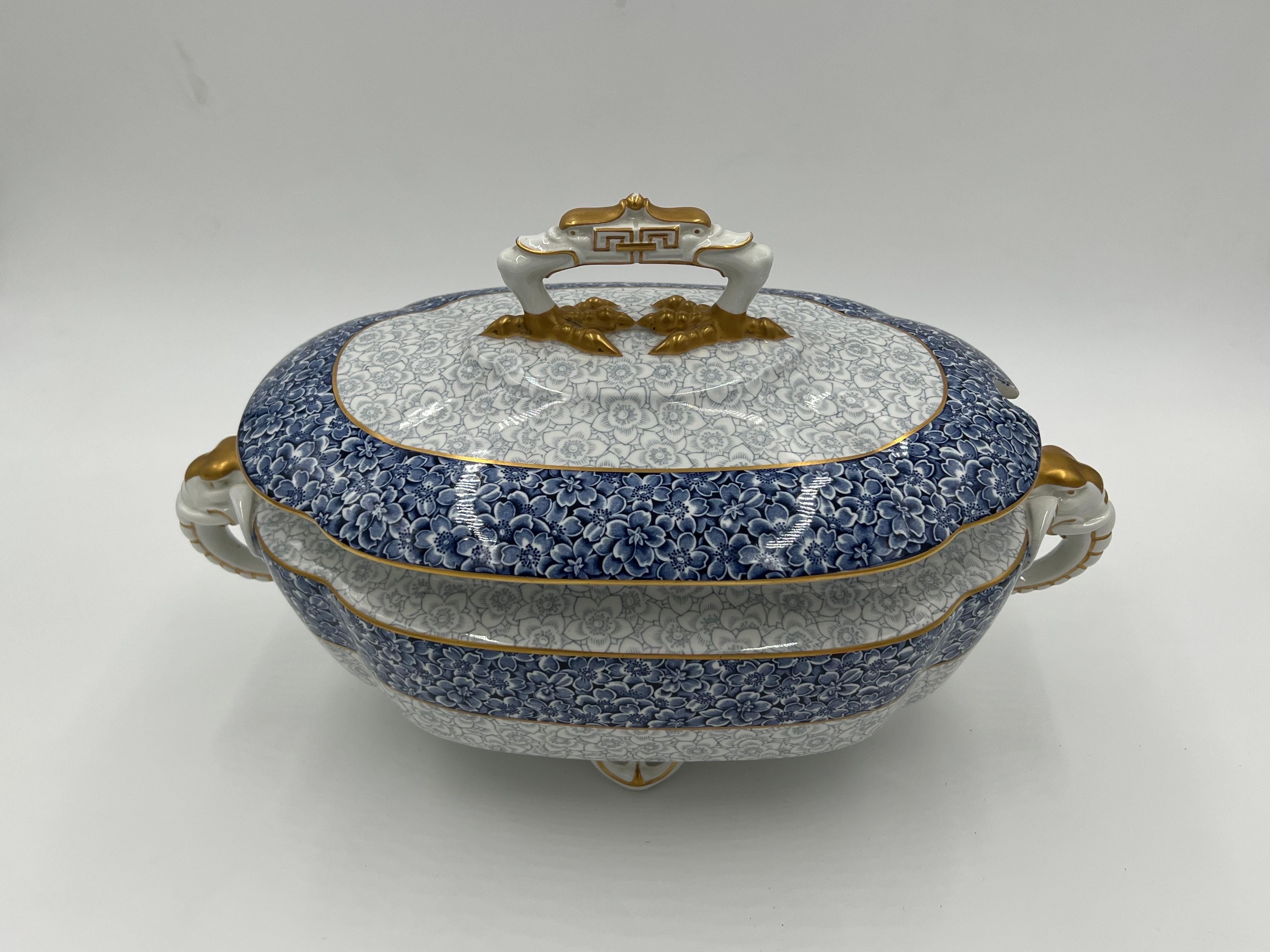 A fantastic Royal Worcester porcelain tureen with fine quality elephant handles and ostrich form foot finial handle to top. Resting on 4 feet and marked to bottom. Circa 1890.