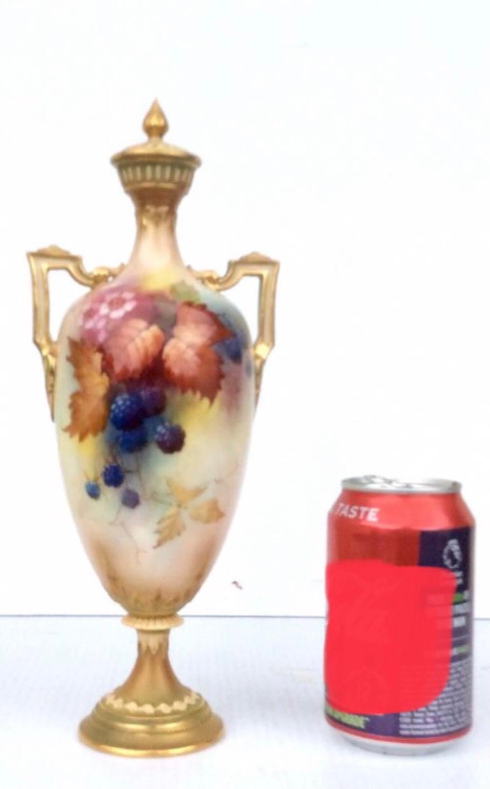 Antique Royal Worcester tall and slender twin handled vase with cover. This classic Worcester item is painted with blackberries and foliage to both faces.It was painted by Albert Shuck, regarded as one of the best fruit painters at Worcester.The