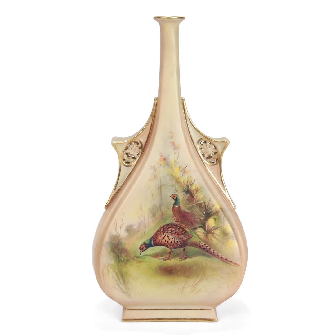 A fine English porcelain vase.

Made in 1900 by George Grainger & Company, a subsidiary of Royal Worcester from 1889 - 1902.

With painted floral decoration on a blush colored body with a wide base that tapers into a narrow neck. There are gilt