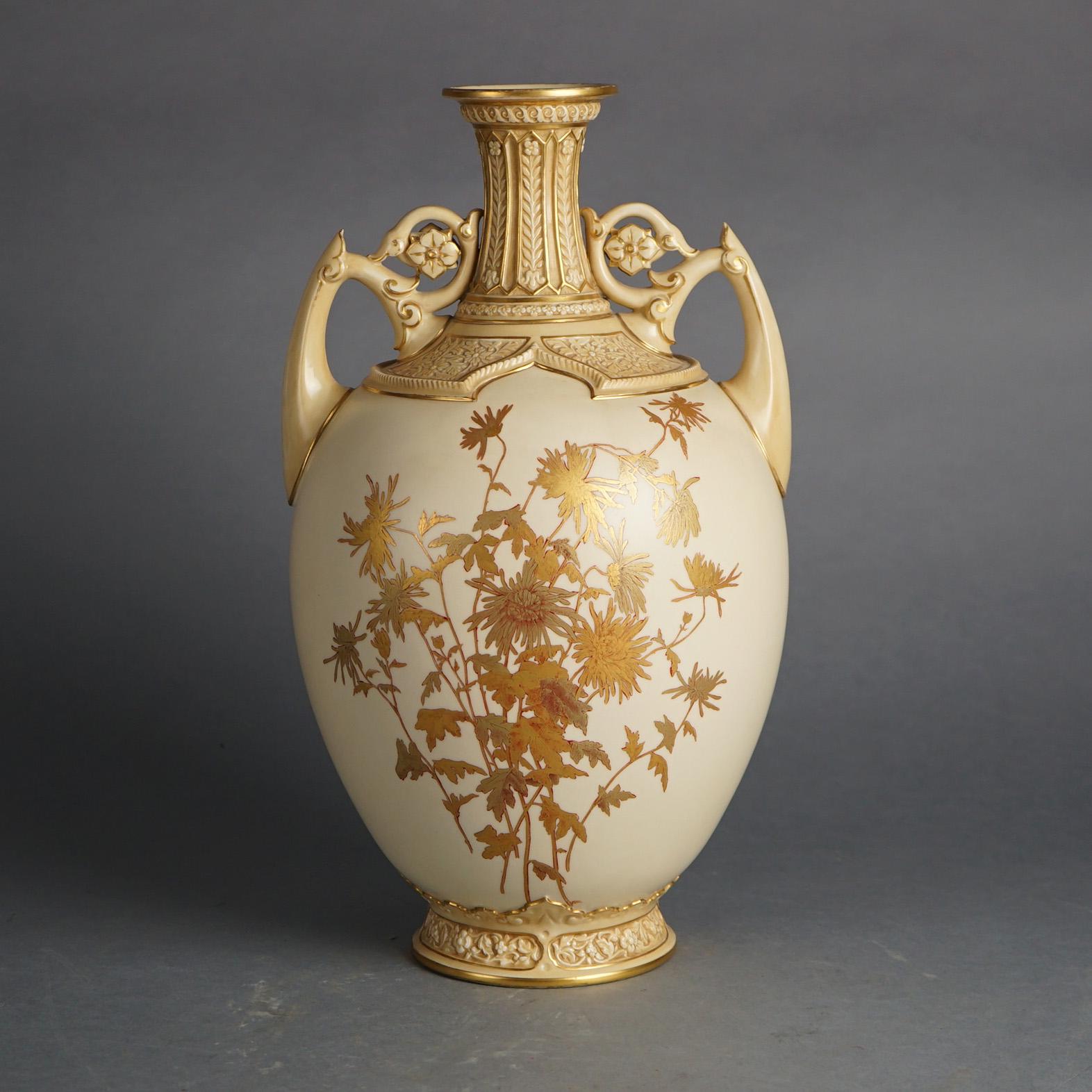 An antique English Royal Worcester vase offers porcelain construction with hand painted and gilt floral decoration, double foliate form handles and rosettes, maker mark on base as photographed, c1890

Measures - 16