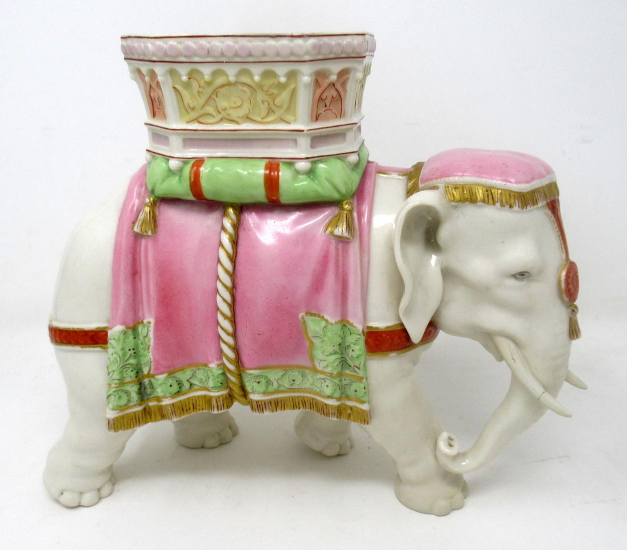A superb and quite rare example of an English Porcelain Elephant vase made by Kerr and Binns of Royal Worcester. Third quarter of the Nineteenth Century. The off-white body standing upright, decorated in colours of soft pink, terracotta and gilt.