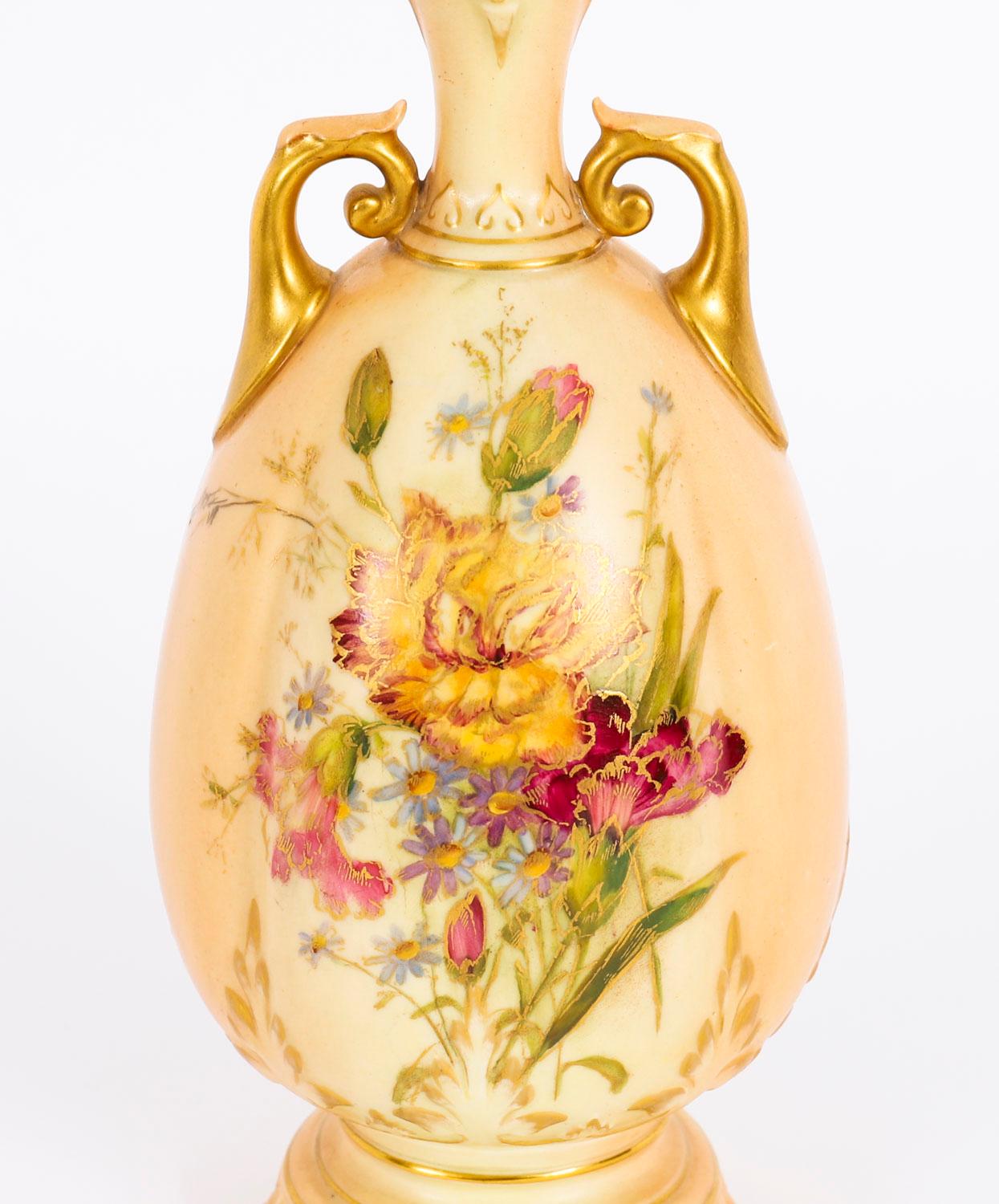This is a stunning antique Royal Worcester porcelain two handled ovoid vase bearing printed marks and the date code for 1909. 

The vase is of footed shouldered ovoid form with a pierced neck and gilt loop handles and painted with wild flowers over