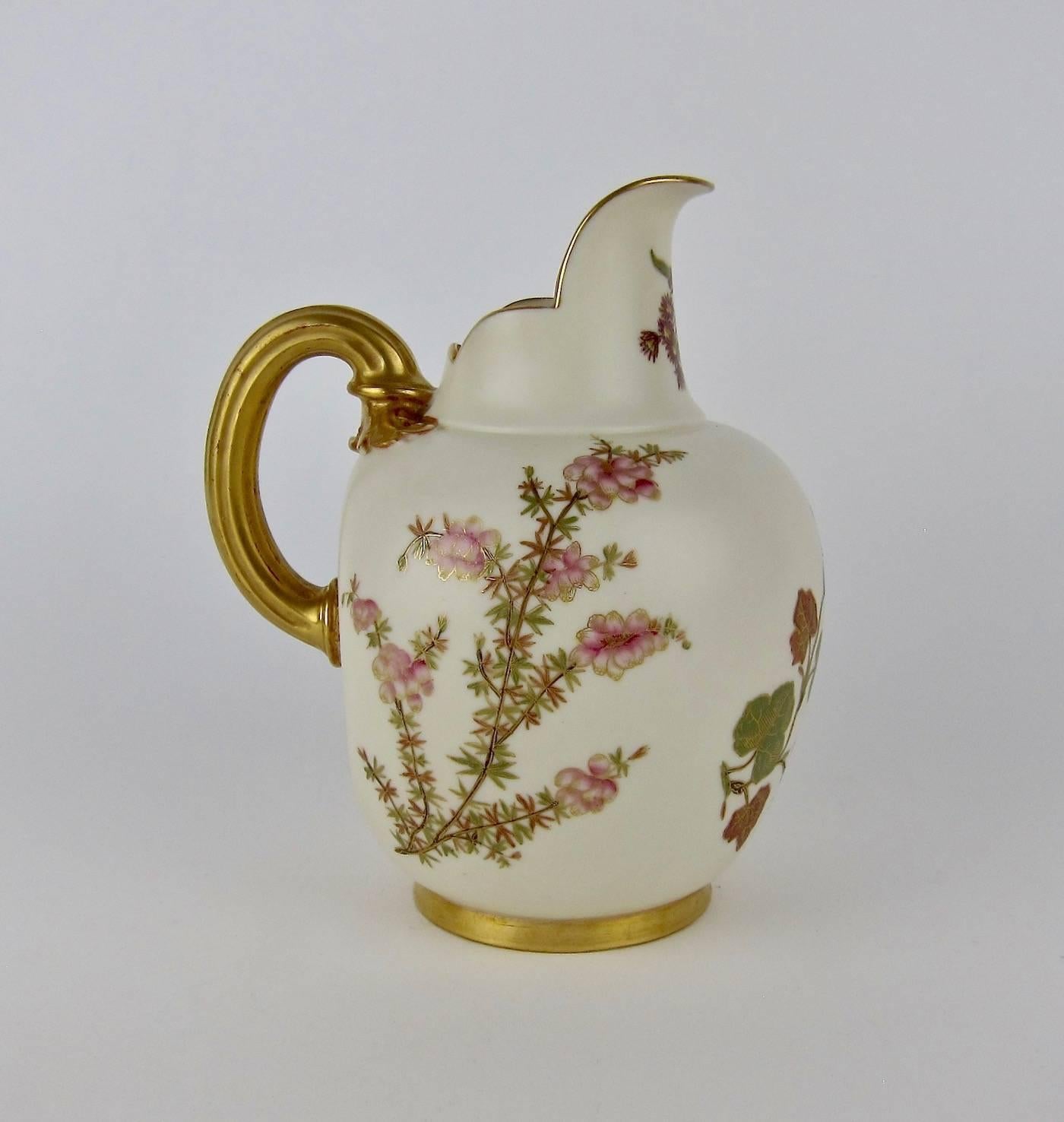 A fine late 19th century flat back pitcher in ivory porcelain by Royal Worcester of England, date marked for 1890. This exquisite antique pitcher is decorated with hand-painted Japanese floral motifs characteristic of Aesthetic Movement and