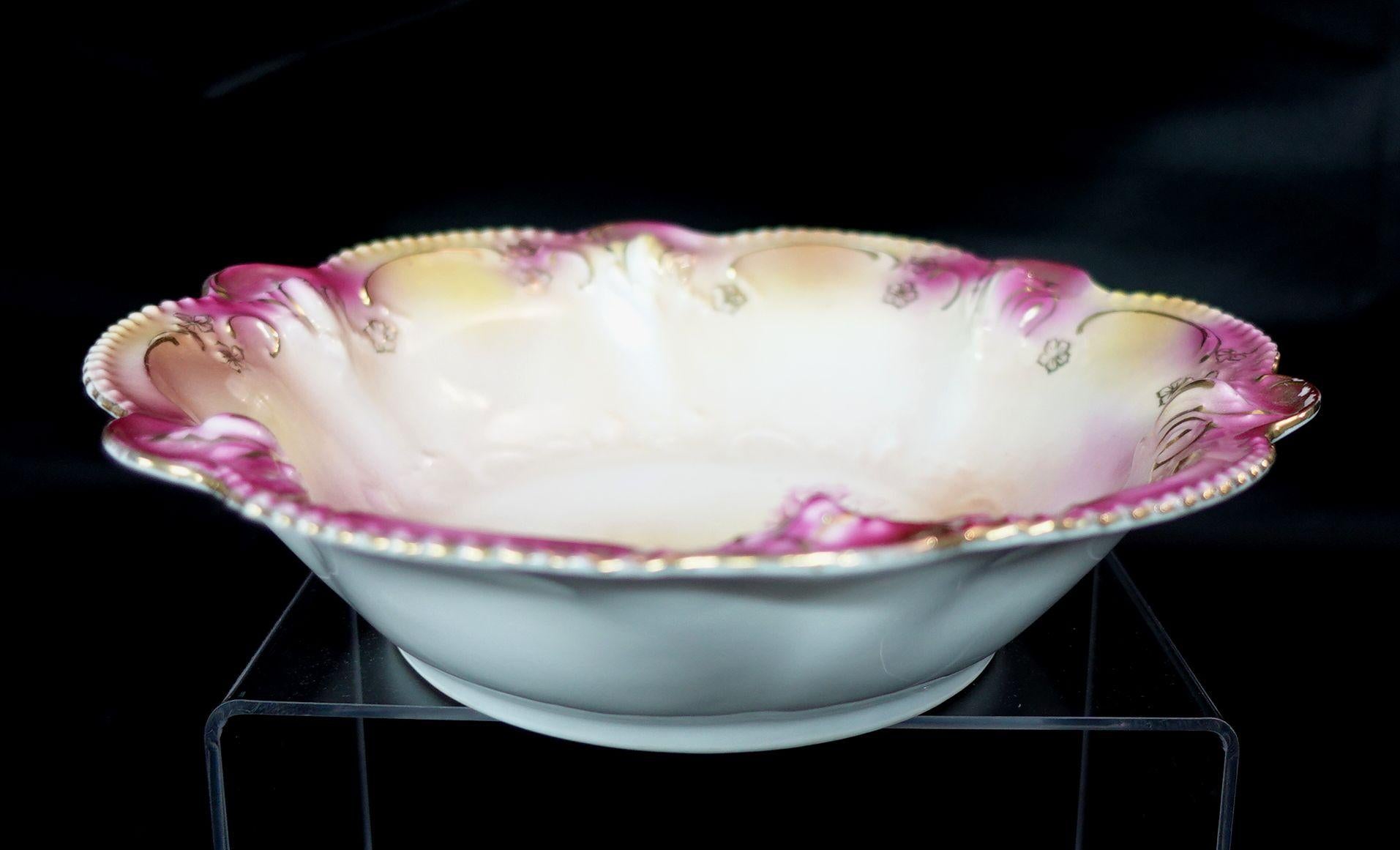 A wonderful RS Prussia German porcelain bowl in lovely multi-colors, the center of the bowl has beautiful many flowers presented in different colors, a very adorable artwork.
 
