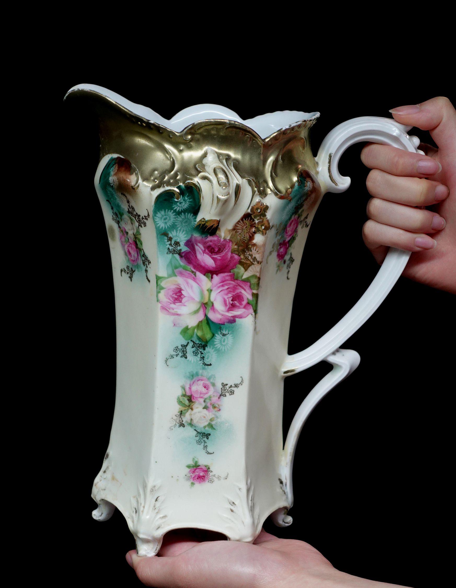 A wonderful antique RS Prussia large Tankard absolutely 100% hand painted floral, roses in pink, purple, red, and rich green leaves, delicate arrangement of the composition, more in some places but less in opposite locations. light and heavy