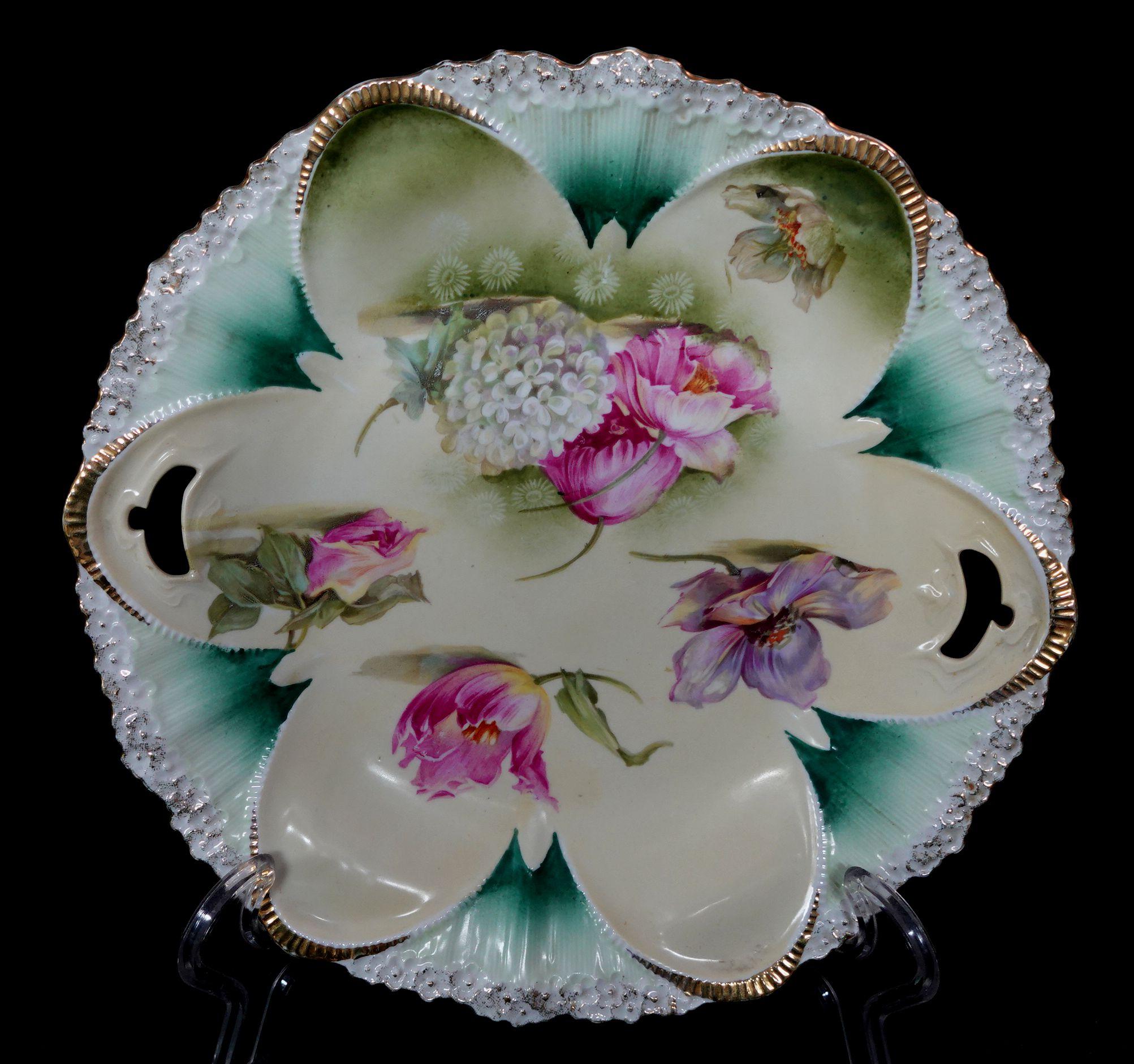 A wonderful antique RS Prussia cabinet plate hand painted floral in different colors and gold trimmed porcelain plate.
   