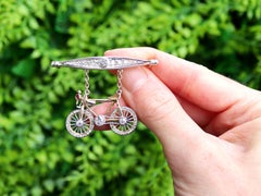 Antique Ruby 1.63 Carat Diamond 9k and 14k Yellow Gold Bicycle Brooch Circa 1915