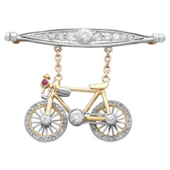 Antique Ruby 1.63 Carat Diamond 9k and 14k Yellow Gold Bicycle Brooch Circa 1915