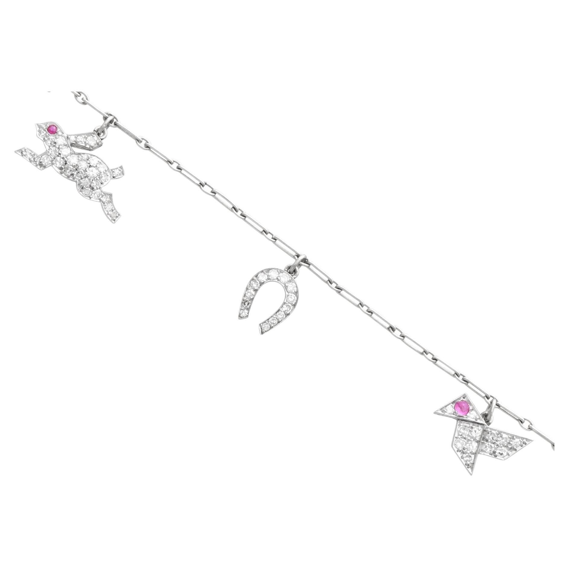 Antique Ruby and 0.85 Carat Diamond Platinum Charm Bracelet Circa 1915 For Sale