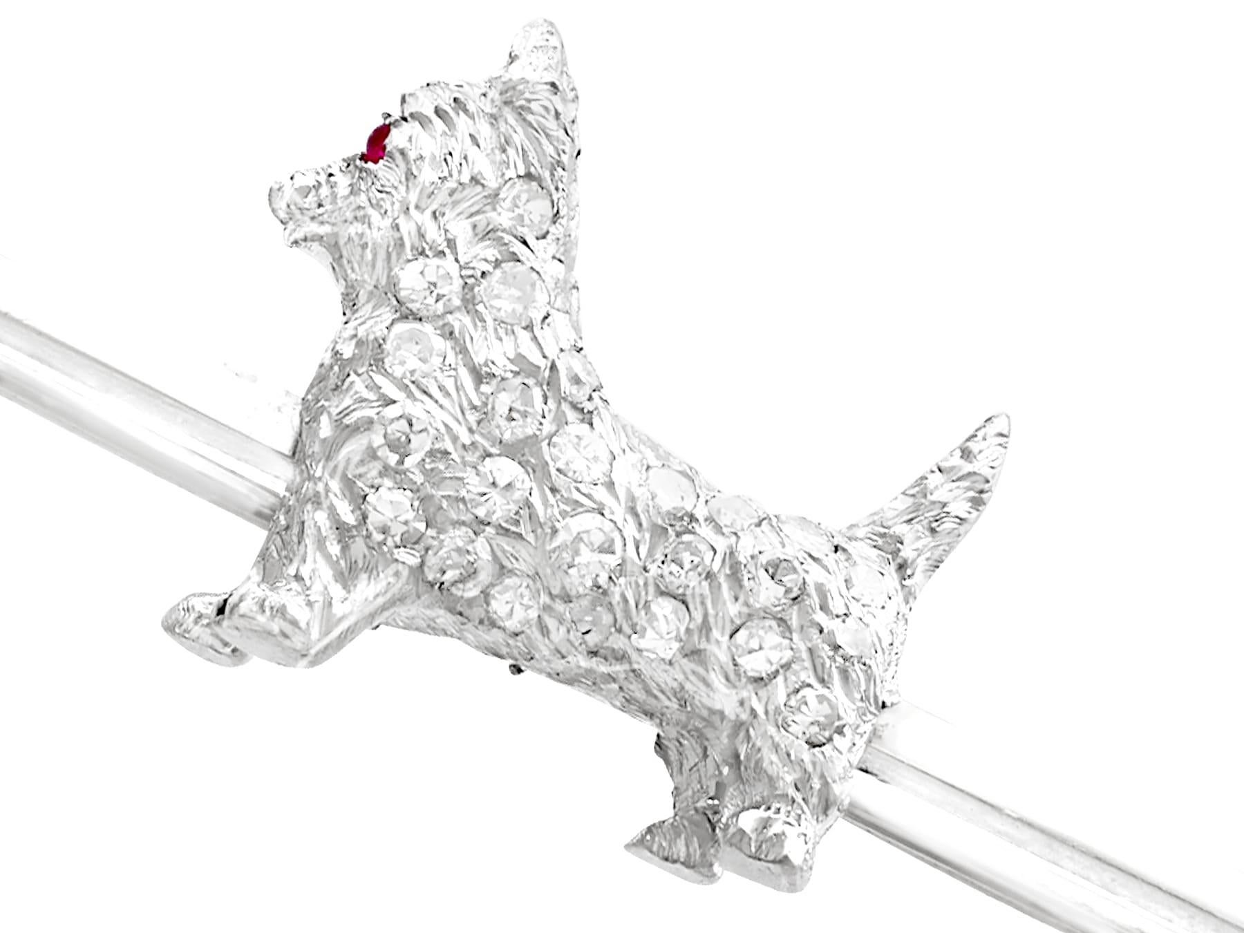An impressive antique 0.02 Ct ruby and 0.48 Ct diamond, 18, 15 and 9k white gold 'West Highland Terrier' brooch; part of our diverse antique jewelry collections.

This fine and impressive antique dog brooch has been crafted in 18k, 15k and 9k white