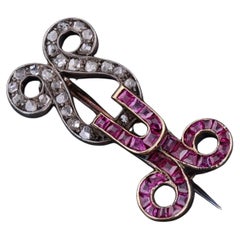 Spilla antica in oro 12ct con rubini e diamanti