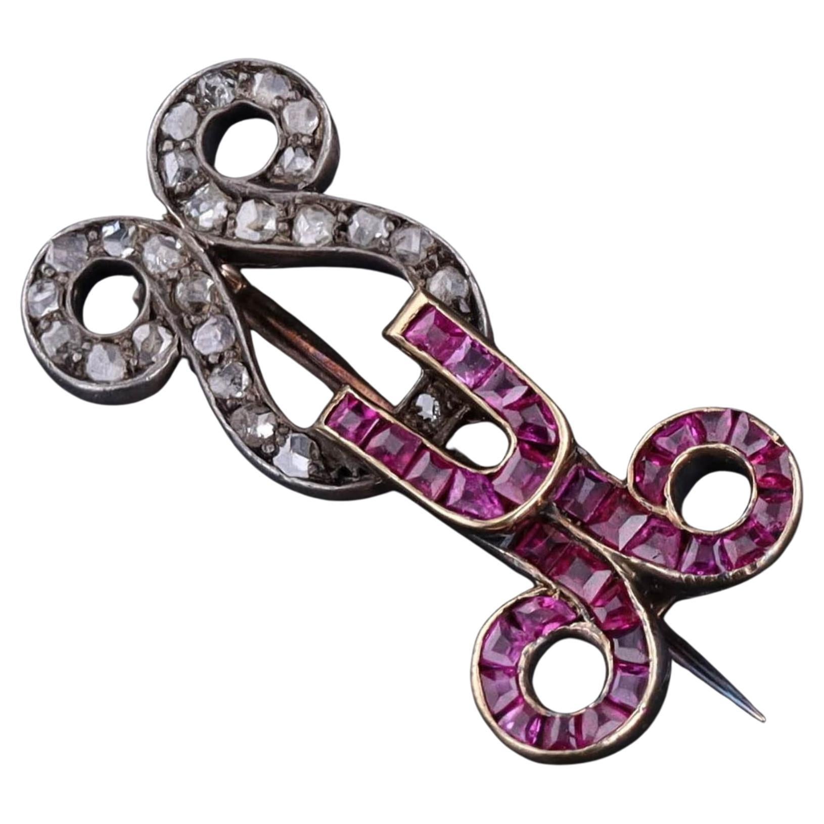 Broche ancienne en or 12ct avec rubis et diamants
